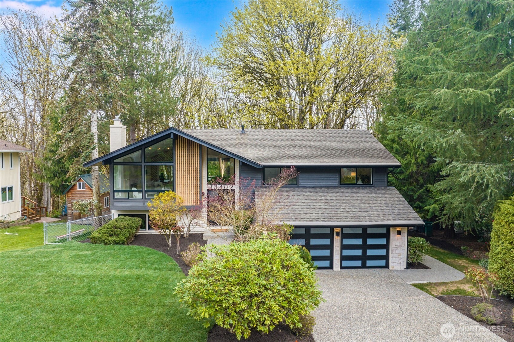 Breathtaking remodeled split-level home in one of Redmond’s most sought-after residential pockets. Quiet, tree-lined streets make this property the best of both worlds: space and privacy yet minutes from everything that makes Redmond highly desirable. This gorgeous property sits on almost 2 acres, including the expansive, wooded backyard, creating a tranquil urban oasis. Additionally, it is zoned for the Lake Washington school district, one of the top-performing districts on the Eastside. Custom, high-end touches throughout the updated home, including lighting, kitchen cabinetry, and unique accent walls. The open concept kitchen, dining, and living room are full of natural light from the expansive front windows. 3 large bedrooms on the upper level, including the primary with a primary en suite bath & large closet, and another full bathroom. Downstairs is also light and bright with an additional living room that includes easy access to the updated deck (perfect for entertaining), a 4th bedroom, a full bathroom AND a gorgeous laundry room. Don't miss the fully fenced dog run and the private fire pit. Exceptional access to recreation: minutes to Sammamish River Trail, 60 Acres Park, and Sammamish Valley Park. Prime Eastside location, as it is close to Downtown, Kirkland, and the Bellevue tech corridor, with easy access to 520 or 405. Do NOT miss this beautiful opportunity!
