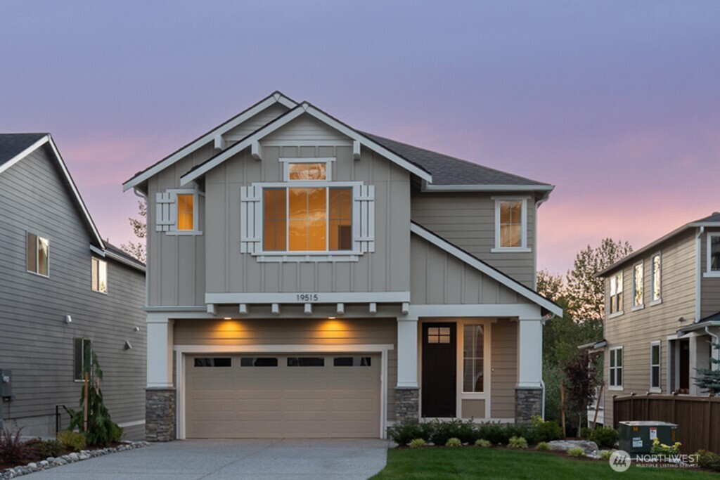$50K PRICE IMPROVEMENT! Our largest plan with 3921 sq ft of flexible living, and large yard that backs to NGPA. Main floor offers spacious great room with dramatic double-sided fireplace, covered outdoor living & peaceful views. Spacious kitchen with quartz counters, soft close cabinetry, pull out shelves, JennAir Rise appliances, pantry, & beverage fridge. Office/den & 1/2 bath round out the space. Second floor light-filled primary with peaceful views. Ensuite offers heated floors, floating vanity, backlit mirrors, huge shower, soaking tub, and 2 custom closets. 3 more bedrooms, full bath, large bonus room, & utility room. Lower-level with large rec rm, wet bar, 5th bedroom, 3/4 bath, and covered deck with yard access. A perfect space for long term guests, home office, or whatever suits you. REFRIGERATOR, WASHER, & DRYER INCLUDED! Full fence, irrigation, EV charger, and AC/heat pump. Northshore SD & easy access to Seattle & Eastside. Move in Ready!