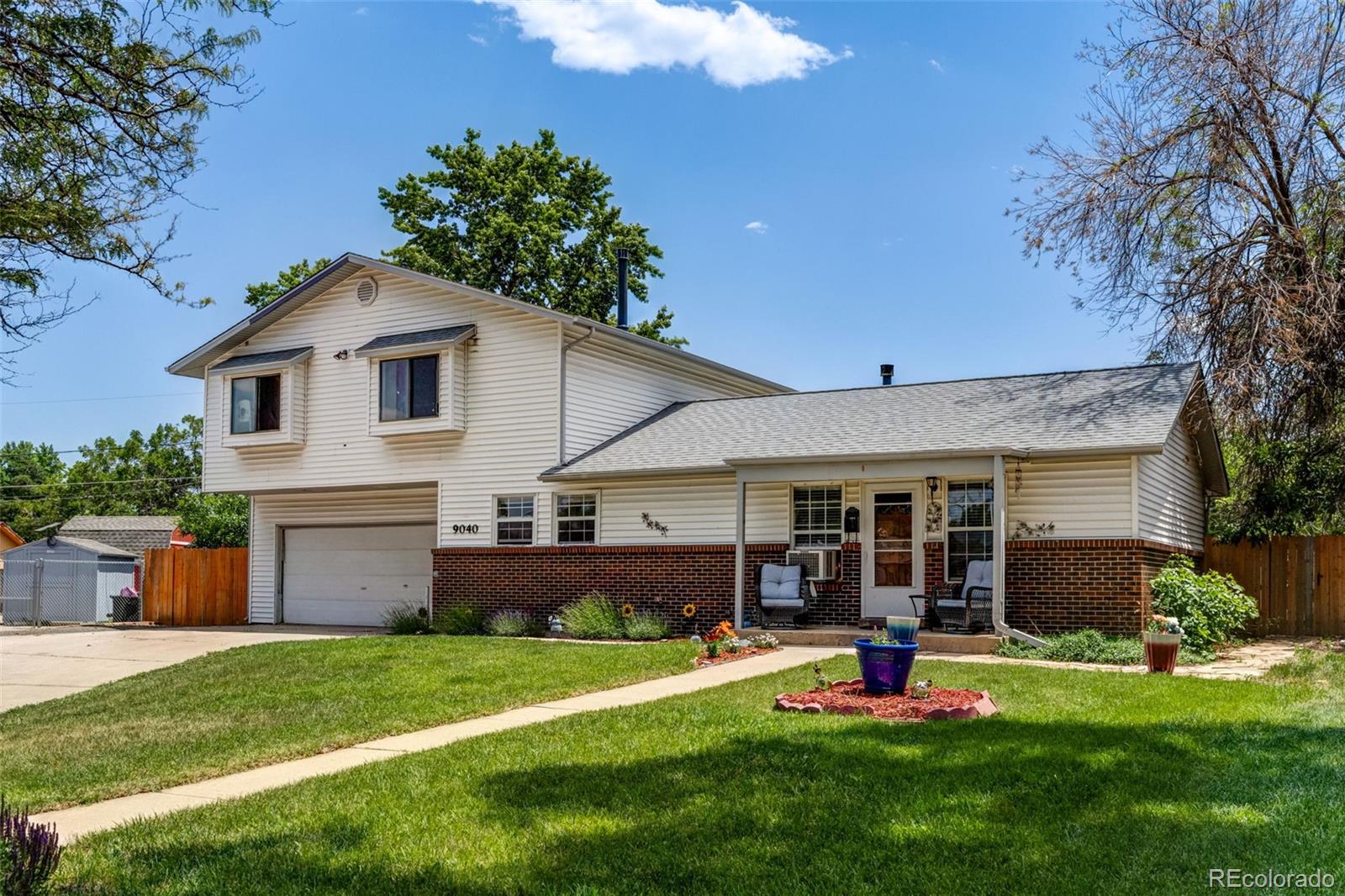 This charming two-story home offers approximately 2,000 sq ft of living space with an unfinished basement. The main floor features hardwood floors, an ensuite perfect for guest bedroom or office, living room, kitchen with eat-in dining, and a mudroom conveniently attached to a two-car garage.  Upstairs, you'll find three additional bedrooms, including a spacious primary suite with a private deck. Enjoy the great outdoors with a large patio, hot tub, and an expansive yard—perfect for entertaining or relaxing. The unfinished basement—complete with rough-in plumbing for a bathroom is ready for your personal touch and has an area that was previously used as a salon, laundry, a wet bar, and more space for a potential exercise room, gaming room, home theater, or additional family room. The exterior features a mix of brick and vinyl siding for low maintenance and timeless curb appeal. This is a solid home with great bones and room to grow—don’t miss this opportunity!