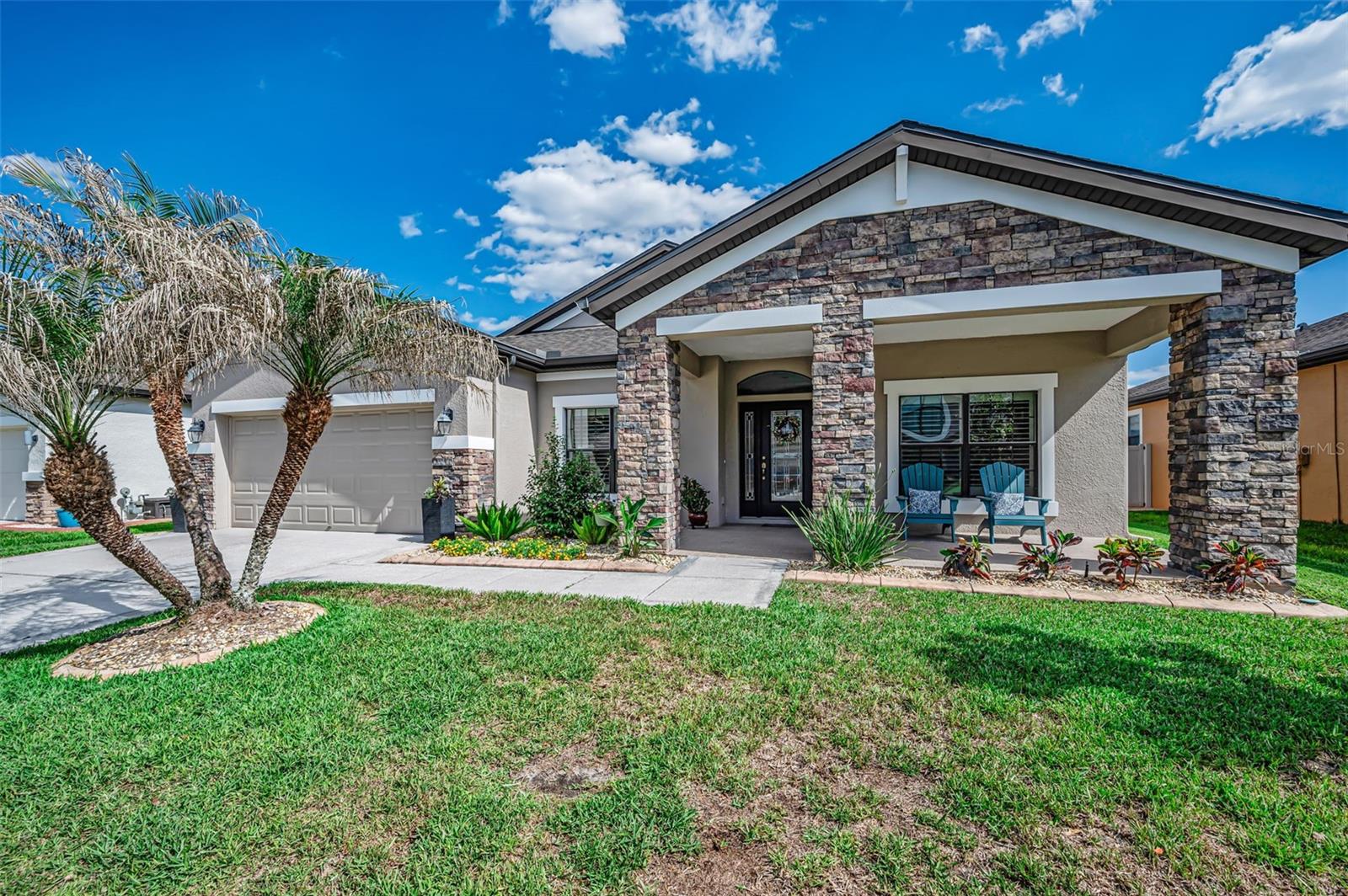 PRIDE OF OWNERSHIP Shows in this METICULOUSLY MAINTAINED Pool Home in the Vibrant MASTER PLANNED COMMUNITY of CONNERTON!(Enclave of Verona). BEAUTIFUL 3 Bedroom Plus Office, 2.5 Bath, 3 Car Tandem Garage with Oversized Birdcaged Pavered Lanai, HEATED POOLwith Large SPILLOVER SPA and Waterfall Feature! Relax or Entertain Family or Friends Under this Expansive COVERED LANAI Enhanced by Twinkle Lights in the Birdcage! Plus a FULLY FENCED BACKYARD!! (PVC FENCE provides PRIVACY) Attractive Leaded Glass Front Door with Side Light! Foyer is Accentuated with Stunning Custom Accent Walls and CUSTOM CROWN MOLDING! Upgraded, DESIGNER LIGHT FIXTURES!! Stunning WOOD FLOORING FLOWS SEAMLESSLY Throughout with Exception of 2 Carpeted Guest Bedrooms! Ceiling Fans with Lights Throughout! NEUTRAL DECOR INTERIOR PAINT!  Desirable OPEN FLOOR PLAN CONCEPT!! GOURMET CHEF'S KITCHEN has White Double Stacked Cabinetry with Lighting! QUARTZ COUNTERTOPS with Stylish TILE BACKSPLASH!! UPGRADED GE Cafe Stainless Appliances! 6 BURNER GAS RANGE with STAINLESS HOOD!! LARGE QUARTZ PREP ISLAND with Oversized Sink! Cabinet Pantry has ROLL OUT SHELVES!!! Mimic's the HGTV LOOK! Family Room/ Dining Room Combo! Wonderful for a Relaxed Lifestyle!! Quality WHITE PLANTATION SHUTTERS!! Oversized Primary En Suite Features 2 Large WALK IN CLOSETS!! Primary Bathroom has Dual Vanities, QUARTZ COUNTERTOPS! Upgraded Mirrors and Light Fixtures! LARGE WALK IN SHOWER with Floor to Ceiling Tile! SOAKING TUB Completes the Room! Desirable SPLIT BEDROOM Plan for Owner's Privacy! OVERSIZED LAUNDRY ROOM Features an Abundance of Built In Cabinetry!  NEWER A/C System - August 2025! NEWER POOL HEATER - Aug 2024, WATER SOFTENER! Gas Hot Water Heater, WINDOW FILM helps with Energy Efficiency! Concrete Curbing around Flower Beds! Palm Tree's, Lush Landscaping! RECLAIMED WATER FOR IRRIGATION, Saves You Money! Amenities Include: Clubhouse, Multiple Resort Style Pools, Fitness Center, Tennis, Pickleball, Volleyball and Basketball Courts! Dog Parks!, Multiple Playgrounds, Parks! Miles of Scenic Trails! PERFECT BLEND  of NATURE Preserves and RESORT STYLE LIVING!! GREAT LOCATION!! Easy Access to Tampa International Airport, Hospitals, Restaurants, Shopping, Sports Venues! Excellent Schools! Golf Cart Friendly Community! PARADISE IS AS CLOSE AS YOUR OWN BACKYARD!! Must See Inside to Appreciate!