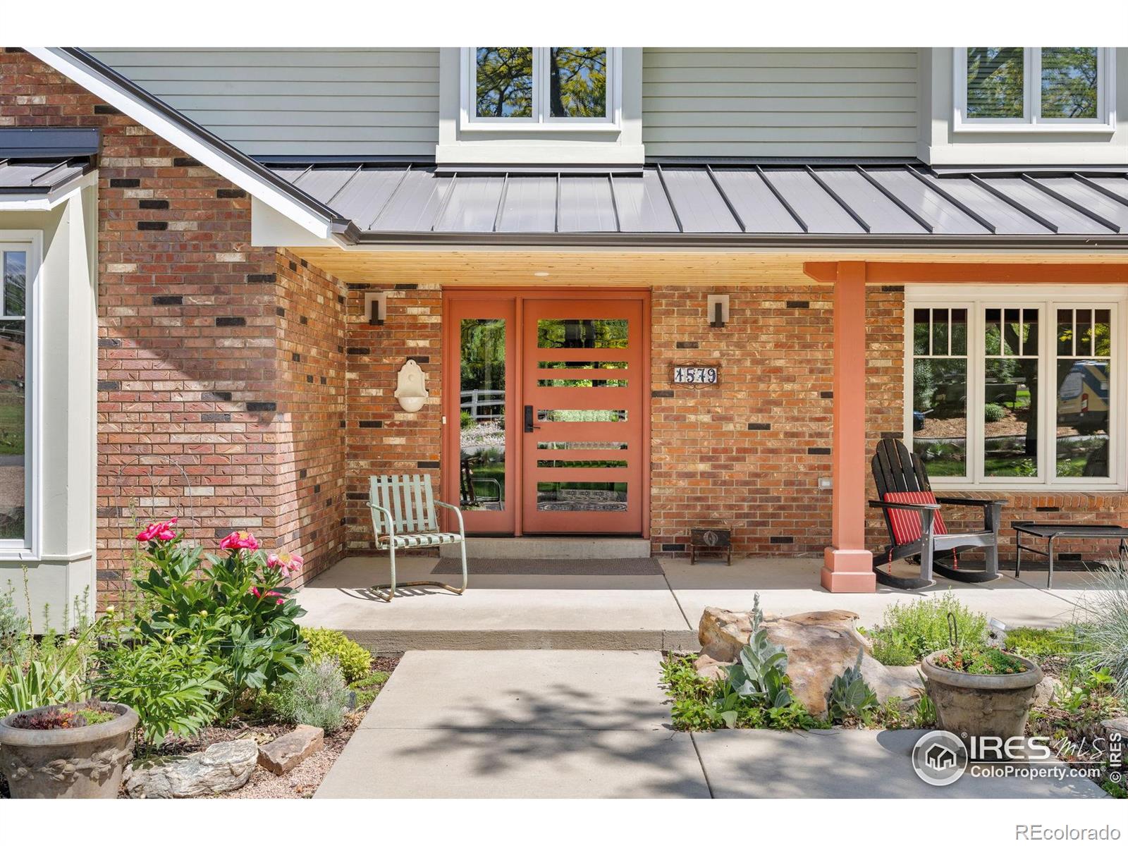 This one is a rare & special find, just minutes from Old Town Littleton. This classic, mid-century modern home boasts a welcoming & homey charm with the simple elegance of Scandinavian styling. Upon entering the home, you're immediately drawn to the wall of windows & luxuriously spacious composite deck, with its artful no-spot glass and metal railing. An entertaining oasis, it's simply enchanting. Thoughtfully designed to be transition free, the home is easily accessible from two exterior entrances, the entire main level, the transition free primary suite shower, even the back deck! The mature landscaping & lush gardens surrounding this home have been lovingly cultivated over the years. The expansive windows throughout the home bring the outdoors inside, creating a seamless connection to the lush landscape. Situated next to Open Space & Lee Gulch Trail, creates a private park-like retreat. Inside, the home showcases custom artful tile work, a tongue & groove knotty pine ceiling, & Canadian marine maple flooring. A striking Texas limestone fireplace, artistically set with a steel mantel, serves as a focal point of the living area. In the kitchen, you'll enjoy custom quarts countertops, Bosch appliances, & a Wolfe range, perfect for the chef in you. The home offers 5 bedrooms & 3.5 bathrooms. Two primary suites with customized closets ensures you'll always have room for guests. The property also boasts a spacious 3-car garage with a composite floor ensuring ample storage & parking.A $1 Mil renovation and addition in 2020 elevated the home's exceptional quality & attention to detail. Situated in a private, no-HOA community, this home offers the ideal setting for those seeking a unique and thoroughly modern living experience.