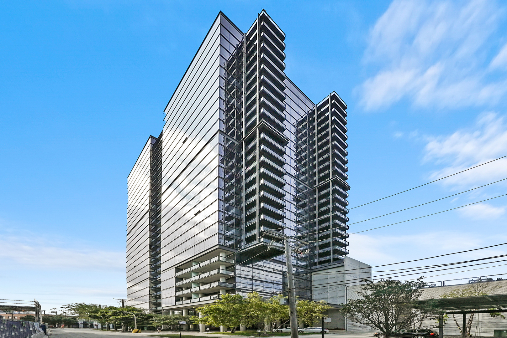 Prepare to be wowed by jaw-dropping, unobstructed skyline views through wall-to-wall windows in the highly coveted southeast-facing '07 tier at SoNo West. This one-of-a-kind residence boasts modern luxury finishes, extensive upgrades, and a massive private balcony that's perfect for entertaining. No detail was overlooked in the dramatic kitchen and bathroom renovations, featuring premium materials and fixtures from Porcelanosa, Ann Sacks, Cambria, KitchenAid, Miele, Hansgrohe, and more. The redesigned kitchen includes a newly added peninsula for extra counter and cabinet space, while repositioning the breakfast bar creates a more open flow into the spacious living and dining areas. Combined with the expansive balcony, the layout is an entertainer's dream. The primary bedroom exudes a modern-industrial vibe with Graham & Brown flocked velvet wallpaper and a custom wood soffit accented by cement bedside lighting. Both the primary closet and oversized entry walk-in closet are outfitted with Elfa customizable storage solutions. Smart home features include integrated lighting, thermostat, and keyless entry. TWO side-by-side garage parking spaces and a storage unit are INCLUDED. SoNo West offers a well-managed HOA with strong reserves, a fully equipped gym with Peloton, 24/7 door staff, and on-site management and maintenance. Lightning-fast internet and a full cable package with HBO are included in the assessments. Experience a neighborhood brimming with curated boutiques, lively cafes, art galleries, and award-winning restaurants. Situated in top-rated school districts, the area is also a favorite among pet owners thanks to its walkable streets, green spaces, and pet-friendly amenities. Enjoy the very best of Chicago's food, art, education, and lifestyle-all just steps from your front door. Explore in 3D-click the virtual tour button to walk through every detail!