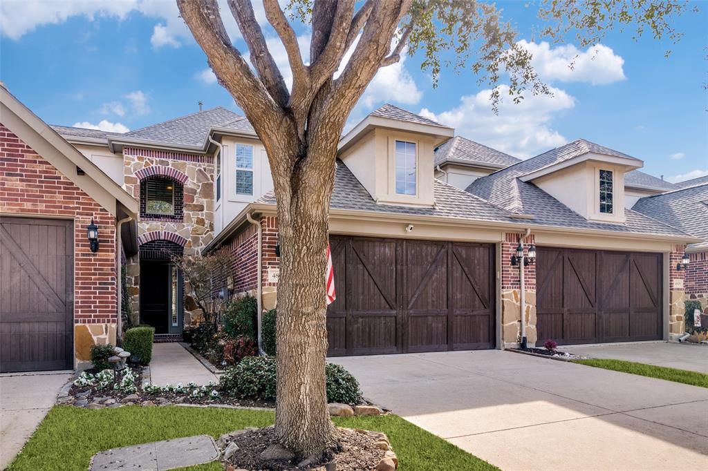 This elegant two-story townhome is a rare greenbelt gem, quietly nestled beside a lush, tree-lined creek in the heart of Plano. A beautifully landscaped path welcomes you to this exceptional home. Inside, soaring ceilings, plantation shutters, and warm, sophisticated tones surround you with an immediate sense of refinement. The open main level flows effortlessly. Natural light pours through oversized windows and doors framing serene greenbelt views. The chef’s kitchen shines with granite counters, a 5-burner gas range, KitchenAid dishwasher, premium Monogram GE double ovens plus convection microwave, and hand-scraped floors that flow throughout the first level. The first-floor primary suite offers a serene retreat, with tranquil greenbelt views, a luxurious spa-inspired bath, and an expansive walk-in closet that provides abundant, organized space. A dedicated laundry room and convenient powder bath bring seamless ease to main-level living. An elegant staircase ascends to a bright landing office that overlooks the living area below, offering an inspiring perch for work or quiet reflection. Upstairs, two spacious secondary bedrooms and a full bath deliver generous, comfortable accommodations. The private rear patio beckons for quiet evenings or memorable entertaining, amid nature’s gentle soundtrack of rustling leaves and the soft murmur of the nearby creek—- a rare find amid an urban setting. An attached two-car garage offers plentiful storage. Just steps from the shimmering community pool, welcoming clubhouse, and shaded park—with swift access to Preston Road, 121, the Dallas North Tollway (DNT), the President George Bush Turnpike (PGBT), premier shopping, and dining—this exceptional residence perfectly marries tranquil seclusion with prime urban convenience.