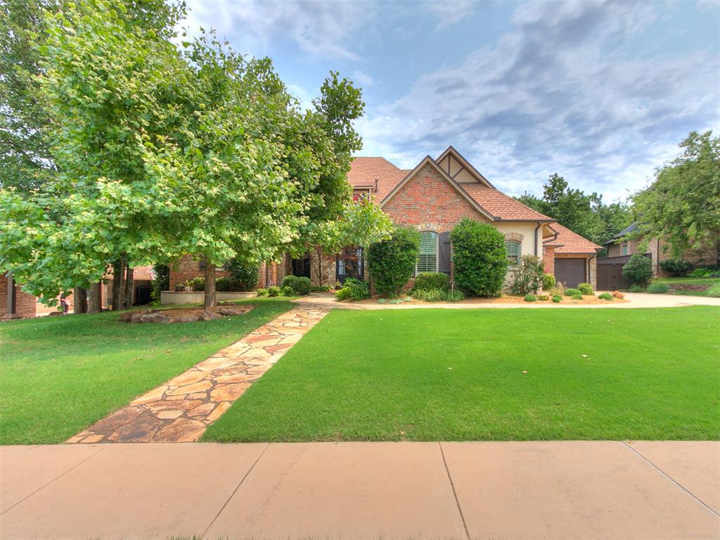 Gorgeous executive retreat on an expansive 0.34-acre cul-de-sac lot in highly sought-after Twin Bridges, walking distance to the community lake, pool, and recreation center. This stunning brick-and-stone home features soaring ceilings, 8-foot doors, and a versatile single-level floor plan where all bedrooms are downstairs. The private primary wing boasts a window seat overlooking the mature trees, a private patio, and a spa-like bath with a soaking tub and extensive closet. The main level also hosts a private office behind French glass doors with floor-to-ceiling built-ins, formal dining, a butler's pantry with a wine fridge, and a chef's kitchen. The kitchen features premium KitchenAid appliances (6-burner gas cooktop, double ovens), dual sinks with touchless operation/Reverse Osmosis water, and elegant granite countertops. Upstairs, a massive bonus/flex room with built-ins serves as an entertainment hub with its own half bath and extensive walk-out attic storage (convertible for future square footage). Retreat to a park-like backyard offering three distinct outdoor spaces, including a custom stone patio. HOA-approved pool plans and landscaping designs are completed and included for major cost savings! Complete with a class-3 roof (2024), gutter guards, and an in-garage storm shelter, this pristine property sits just 3 miles from the upcoming Legacy at Covell lifestyle development (Whole Foods, Ruth’s Chris, Lululemon).
