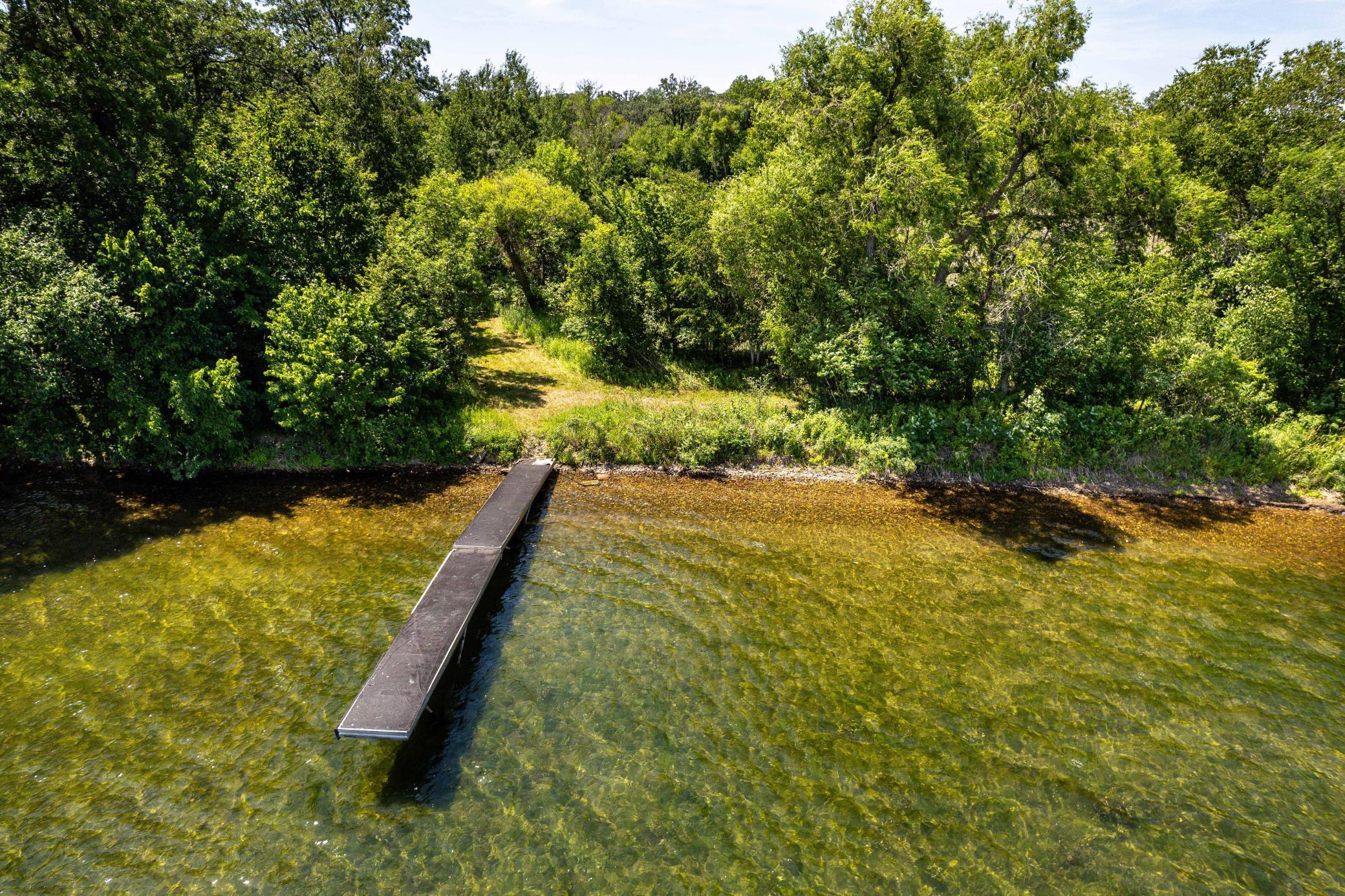 Discover a rare opportunity to own nearly 7 acres of private land on highly coveted Pickerel Lake, known for its exceptional water clarity — over 30 feet at times!  With just over 160 feet of stunning shoreline, this property offers a blend of mature hardwoods and natural wetlands, ideal for a custom lake home, weekend retreat, or future investment.  Pickerel Lake is one of the most desirable lakes in Otter Tail County, offering outstanding fishing, fantastic boating & water recreation, and clean, crystal-clear swimming waters.  Perfectly located only 20 miles to Fergus Falls and only 12 miles to Underwood, right in the middle of Otter Tail County lakes country.  Whether you're looking to build your forever home or secure a slice of lakefront paradise, this property delivers privacy, beauty, and unbeatable lake access.  Possibility of building at the path intersections on the high section near County Road 115.  Schedule your showing today!