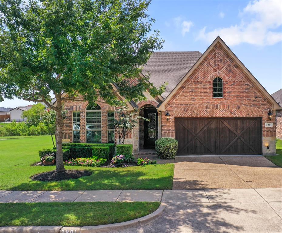 Welcome to this charming one-story home in the Abbey Moor section of The Highlands at Trophy Club. Built in 2011, it offers beautiful wood floors throughout most of the main living areas, 2 bedrooms, 2.1 baths, and a fabulous private office with built-in bookcases, a coffered ceiling, and a cozy window seat overlooking beautiful Corps of Engineer property—an ideal space that could also serve as a 3rd bedroom. The thoughtful split layout provides privacy, with a guest suite and full bath tucked away from the primary retreat, which features a wall of windows, dual vanities, garden tub, separate shower, and a generous walk-in closet. The formal dining room offers flexibility for entertaining or can easily be used as a second office. At the heart of the home, the light-filled living area with its floor-to-ceiling stone fireplace opens seamlessly to the kitchen with granite counters, large center island, stainless appliances, gas cooktop, and walk-in pantry. A breakfast nook leads to the inviting back patio and yard, perfect for relaxing or enjoying nature. Located near the end of a quiet cul-de-sac in this sought-after golf community, the home is just steps from walking trails and only minutes to DFW Airport, shopping, dining, and award-winning schools. NEW ROOF 2022