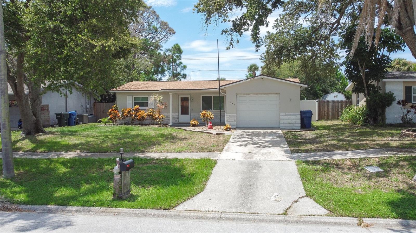 Welcome to 1021 San Marco Dr! Located in a non-flood zone with no HOA or CDD, this charming 2-bedroom, 2-bathroom home offers a comfortable layout,thoughtful updates, and a spacious backyard with plenty of room to make it your own. .Inside, you’ll find a remodeled kitchen with newer appliances, a dedicated eat-in area, and a beautiful kitchen window that brings in plenty of naturallight. The spacious living room features built-in shelving, adding both character and convenient storage. Both bedrooms offer generous space and featurenew carpet, creating a fresh and comfortable feel throughout the home. The two bathrooms retain their classic charm and are well maintained, giving thenext owner the opportunity to personalize them over time. With many of the larger updates already completed, you can focus on making the home your own.Major updates include a 2024 roof, 2024 AC, and all-new impact windows, providing peace of mind and valuable upgrades for Florida living. The home alsofeatures a 2017 water heater, a one-car garage with additional storage, and vinyl fencing surrounding the property.And then there’s the backyard! The large, fully fenced yard offers plenty of space for entertaining, pets, gardening, outdoor activities, or even addinga pool. There’s room to create the backyard setup you’ve always wanted without feeling cramped.Location is another highlight, offering convenient access to parks, shopping, dining, and some of Pinellas County’s most popular outdoor destinations.Enjoy being near Largo Central Park, Largo Central Park Nature Preserve, John S. Taylor Park, the Florida Botanical Gardens, and Heritage Village, withIndian Rocks Beach and the Gulf beaches just a short drive away. You’ll also appreciate easy access to major roads, making trips toward Clearwater, St.Petersburg, and surrounding areas convenient.This home combines the modern updates you want with the space you need, all in a convenient location that makes it easy to enjoy everything Largo andPinellas County have to offer. Come take a look and discover the possibilities for yourself. This is a home you can move into, enjoy, and make your own!