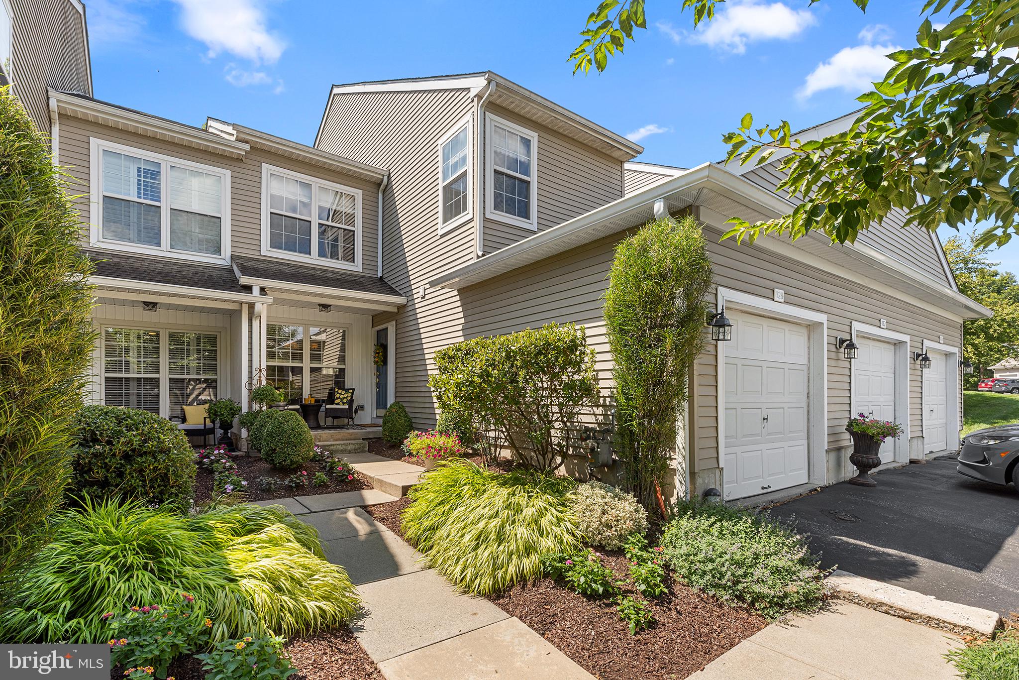 Welcome home to 128 Lewisville Court—where timeless style, everyday comfort, and an exceptional community come together. Experience the perfect blend of comfort, style, and convenience in this beautifully maintained townhome nestled in the highly sought-after Charlestown Hunt community. From the moment you step inside, you'll appreciate the warmth of rich hardwood flooring that spans the entire main level. The bright, open-concept kitchen and dining area create a seamless space for everyday living and effortless entertaining. Featuring stainless steel appliances, classic oak cabinetry, and generous counter space, the kitchen is as functional as it is inviting. The spacious, sun-filled living room offers the perfect place to relax and unwind, with sliding doors leading to a private rear deck—ideal for morning coffee, summer barbecues, or peaceful evenings outdoors. A convenient first-floor laundry room and powder room complete the main level. Upstairs, beautiful oak hardwood flooring continues through the hallway, leading to the impressive primary suite. This private retreat features soaring cathedral ceilings, a spacious walk-in closet, and a luxurious en-suite bath with a soaking tub, walk-in shower, and oversized double vanity. Two additional generously sized bedrooms, each with ample closet space, share a well-appointed full hall bath. The unfinished basement offers endless possibilities to customize the space to fit your lifestyle—whether you envision a media room, home office, fitness studio, playroom, or additional living area. All these features plus an attached 1-car garage with a whole-house plug-in generator.  Enjoy the outstanding amenities that make Charlestown Hunt one of the area's most desirable communities, including scenic walking trails, a community pool, fitness center, tennis courts, and beautifully maintained open spaces. Located just minutes from the vibrant heart of Phoenixville Borough, you'll enjoy easy access to award-winning restaurants, boutique shopping, breweries, parks, entertainment, and year-round community events. With its exceptional location, low-maintenance lifestyle, and thoughtfully designed living spaces, this home truly has it all.