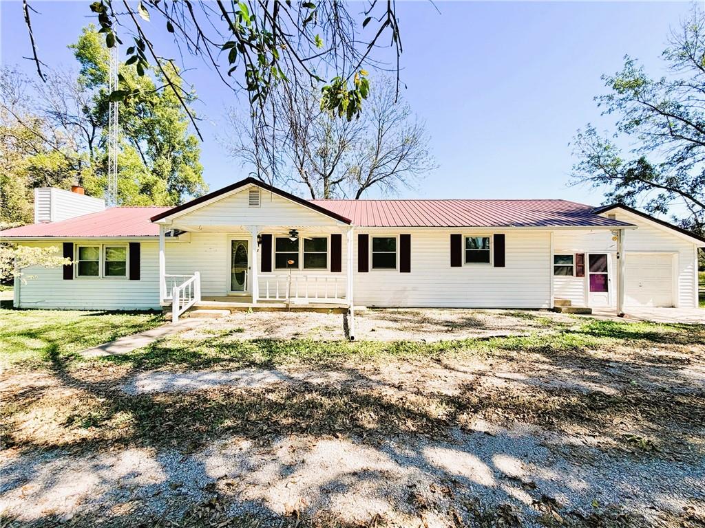 Outdoorsmen, Hunters & Fishermen!!!!  This would be a perfect base camp for all your outdoor activities in Bates County and surrounding area!!  You are close to the 4 Rivers Wildlife Conservation area.  This 1.7 acre lot on the East edge of Rich Hill will meet all your needs.  This spacious 1700+ Sq foot - 3 Bedroom, 2 1/2 bath home with Living rm & Family rm w/ fireplace would give you plenty of room.  Large Kitchen w/ Oak cabinets, gas range & refrigerator. Large Laundry room.  The attached garage has the second full bath Plus a workbench. Vinyl siding for easy care.  There are 2 propane tanks.  The barn/garage  w/ electric service will provide abundant space for storage and/or working on your projects.  The barn also has an  attached garage, perfect for your duck blind !!  Not a sportsman, This home will provide Wonderful space for your Family to enjoy.  Note, the North 2 rooms are part of the original home,  the remainder was built in the 80"s  Come check this one out for yourself!!!!