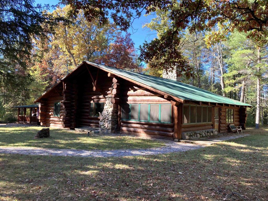 FULL LOG! This rare, historical log cabin in northern Michigan offers timeless charm, tucked in the peaceful, 35M/L wooded acres with winding trails and abundant wildlife. Perfect for hunting and outdoor recreation and a true fly fishermans paradise! Its just a short walk to the world-renowned S. Branch of the AuSable River-Mason Tract, celebrated for its unmatched trout fishing, canoeing, tubing and kayaking. The historical 3 bedroom 1.5 bath lodge proudly marks its 100 year anniversary THIS YEAR, and was originally built by the famous author James Oliver Curwood. It showcases a one of a kind, giant stone chimney and gorgeous fireplace, the cabin is as striking as it is unique. Even Curwood himself once proclaimed, ‚Å“I wouldnt trade that cabin for all of Europe.‚  This is more than a property-its a once-in-a-lifetime opportunity to own a piece of history in Michigans great outdoors. Theres more! A 24x38 full log garage, hunting plot, blinds, a giant enclosed screen porch, covered front porch, vaulted ceilings, wood floors and even borders State Land with the river to the North and Federal Forest to the South! The log exterior and stonework were extensively renovated, along with the garage so not much to do but enjoy! Close to trails and great golfing too!