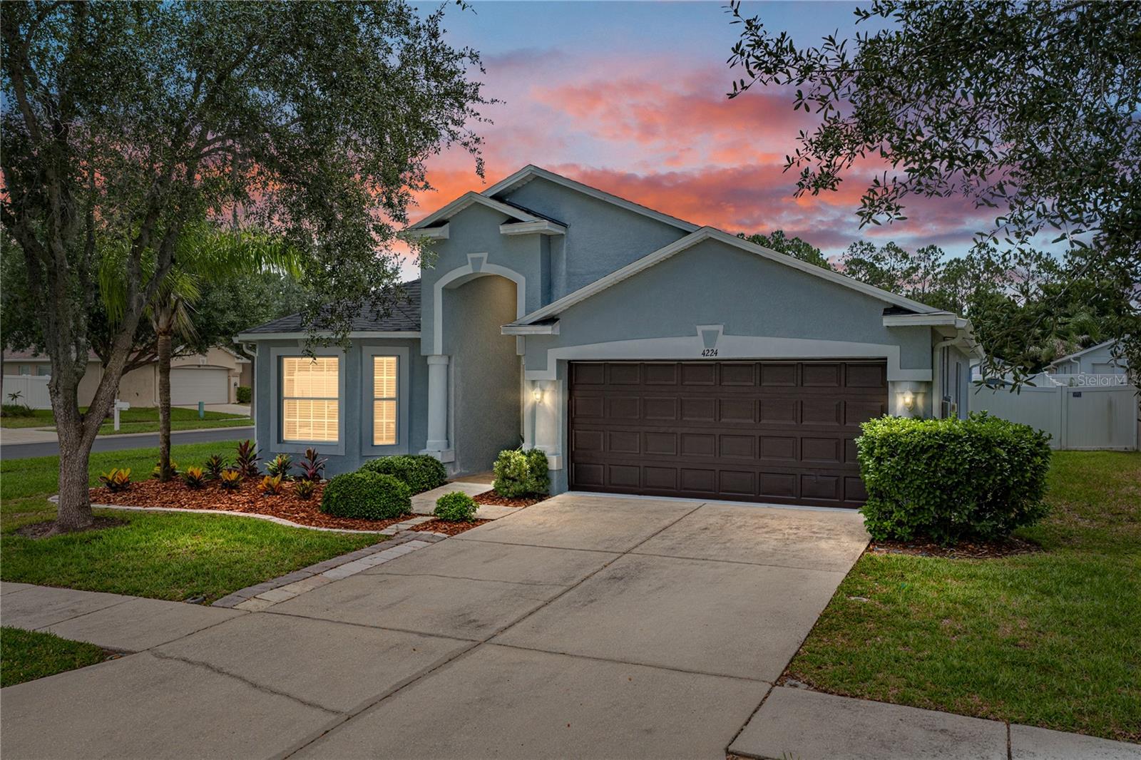 STUNNING Privately Gated & Immaculately Done ONE STORY w/Gorgeous Curb Appeal TRUE 3 Way SPLIT PLAN 4 Bedroom Home, w/3 Spacious Full Baths & 2 Car Garage Located in a Highly Sought after Wesley Chapel Location on an OVERSIZED 71X110 Fully Fenced Corner Lot  BRAND NEW ROOF (2025), BRAND NEW WATER HEATER w/Expansion Tank (2026),  BRAND NEW SEALED WOOD LOOK TILE FLOORS & LVP (2026) Throughout  "NO CARPETING ANYWHERE", NEW INTERIOR PAINT Ceilings, Trim, Doors & Walls Including Garage (2026), NEW EPOXY GARAGE FLOORS (2026).  ALL NEW A/C DUCTWORK REPLACED in (2026), A/C Serviced in 2026 (Installed in 2017).  Fabulous Layout w/Awesome Kitchen w/Loads of SOLID WOOD Cabinetry Recently updated in (2026), BRAND NEW HIGH END SLEEK FLUSH SAMSUNG STAINLESS STEEL KITCHEN APPLIANCES, STAINLESS TUB DW, HIGH END CONVECTION RANGE, BUILT IN MICROWAVE, MODERN DESIGN REFRIGERATOR (2026), Cozy informal eat in Kitchen, Long 4 Seat Bar Top Seating Area, Spacious Pantry all open to Wonderful Family & Dining Rooms! Soaring Vaulted Ceilings throughout most of the home. Kitchen & Family Room make an amazing "Heart of the Home" This truly is a wonderful entertaining space & offers lots of room to spread out. So many NEW Updates NEW 2" Wood Blinds Throughout (2026), NEW HI END 5 1/4" Baseboards (2026), NEW Modern Light Fixtures Throughout (2026), NEW High Efficiency LED Bulbs in all the can lighting & All NEW CEILING FANS w/LIGHTS all you can customize from Soft to Bright Light (2026), Primary Suite is a True Sanctuary w/Fantastic King Size Bedroom layout, massive 10X6 Walk in Closet, Ensuite Bath w/Updated Solid Wood Dual Sink Vanity, New Hardware, Separate Garden Tub & Shower, Linen Closet & Sliding Door Access to the LG COVERED LANAI & Additional 13x15 PAVER PATIO!! Second & Third Baths are also Updated w/Spacious Solid Wood Vanities w/NEW HARDWARE, NEW LIGHTING & NEW LVP FLOORING. NEW HARDWARE Throughout (2026). Located in the Highly Sought After Meadow Pointe Community in the Gated Enclave of Whinsenton Place just next to the amazing facilities including multiple clubhouses, pools, lighted tennis courts, basketball courts, pickleball courts, fitness centers & More. In the Fantastic Wesley Chapel Area w/Well OVER 100 UNPARALLELED DINING OPTIONS, Nightlife, Rooftop Bar & Lounges, FANTASTIC Shopping, Costco, Sam's, Entertainment & Top Medical Facilities. Convenient to I 75, SR56 & SR 54 where you can enjoy the Shoppes at Wiregrass, The New Tampa Premium Outlets, The Grove at Wesley Chapel including Krate the super cool Venue offering dozens of Restaurants, Shopping & Entertainment with an outdoor venue for LIVE CONCERTS, Watch Parties & More, FARMERS MARKETS, ANTIQUE CAR SHOWS & MORE! The Largest Ice Rink in the Southern US, Close to The First Outdoor Winter Snow Park Snow Cat Ridge w/Ice Skating, Snow Tubing, Dining & Entertainment in the Igloo Village. Access to the best Healthcare NEW John's Hopkins Hospital & Florida Medical Clinic Hospital Both Under Construction, Multiple New Advent Health Hospitals, New Bay Care Hospital, Moffitt Cancer Center, VA Hospital & USF Health already Built. This home is in a prime location w/in Wesley Chapel closer to Tampa and has amazing Easy Access to the interstates and all the shopping & restaurants without all the traffic! A quick trip to Busch Gardens & Great Access to the Beaches & Downtown straight up either 56 or 54 from this location. HOA is only $104 a year including Trash Pickup & Gated Access! This is a must see!