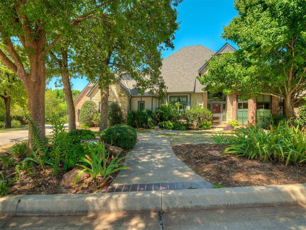 This well-appointed home features an open, flowing layout with soft, washed woodwork and upscale finishes. The kitchen is equipped with granite countertops, stainless steel appliances, double ovens, and a spacious pantry—perfect for any home chef. Adjacent to the kitchen is the main living area with a vaulted ceiling and fireplace, ideal for entertaining or relaxing. The first floor includes a private primary suite with a large walk-in closet, built-in safe room, and a large bathroom with walk-in shower and whirlpool tub. Also on the first level is a second bedroom with its own ensuite bathroom. Additional first floor highlights include a spacious foyer, home office/study, a second living room just off the entry, and a breakfast room with lots of windows providing a view to the backyard. Upstairs, you'll find two more bedrooms connected by a shared bathroom, a balcony, plus two flexible spaces—one with hardwood flooring, ideal for a media room, game room, or additional study, and another cozy space perfect for crafts or another office. One of the many upgrades the sellers did was to enclosed part of the attic to create a climate-controlled storage area—and don’t miss the hidden closet tucked away for a fun surprise! There are two separate, two-car garages with built-in storage and epoxy floors. Tall Oaks Crossing is a cozy, gated neighborhood tucked away in SE Edmond, and is just minutes from I-35.