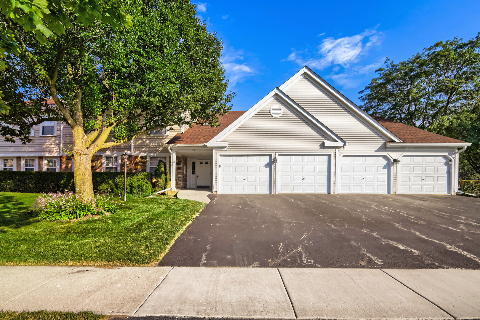 Welcome home to this beautifully updated, move-in-ready FIRST-FLOOR END UNIT in sought-after Towne Place West! Offering approximately 1,250 sq. ft., 2 bedrooms, 2 full baths and an attached 1-car garage, this spacious Elm model combines easy one-level living with thoughtful upgrades and everyday convenience - NO STAIRS! Step inside to a bright, open floor plan with plenty of natural light, continuous wood-laminate flooring and a welcoming living room centered around a cozy gas-log fireplace. The living and dining areas feature convenient AUTOMATIC BLINDS that can be controlled right from an app, while updated lighting adds a fresh, modern feel throughout the home. The kitchen has been thoughtfully upgraded with granite countertops, contemporary brick-style backsplash, a large single-basin stainless-steel sink, generous cabinet and counter space, pantry storage and modern, long-lasting DIMMABLE LED RECESSED LIGHTING. A movable island with butcher-block top offers additional prep and serving space and stays with the home. The dining area features an updated light fixture and opens directly to your private concrete patio - a perfect spot to relax, entertain or enjoy your morning coffee. The spacious primary bedroom offers an ensuite full bath and large walk-in closet. A generous second bedroom with ample closet space provides flexibility for guests, a home office or hobby room. Both bathrooms feature updated flooring, and the home also includes convenient in-unit laundry. Major mechanical updates provide additional peace of mind, including FURNACE (2020), HOT WATER HEATER (2022) and A/C (2023). Towne Place West residents enjoy TWO community pools, a clubhouse available for private gatherings, professionally maintained grounds and easy access to shopping, dining, parks, Schaumburg's library, Woodfield Mall, expressways and nearby Metra stations. Bright, spacious, updated and designed for easy first-floor living - this END UNIT offers features you won't find in every Towne Place West home. Come see everything 75 Larch has to offer!
