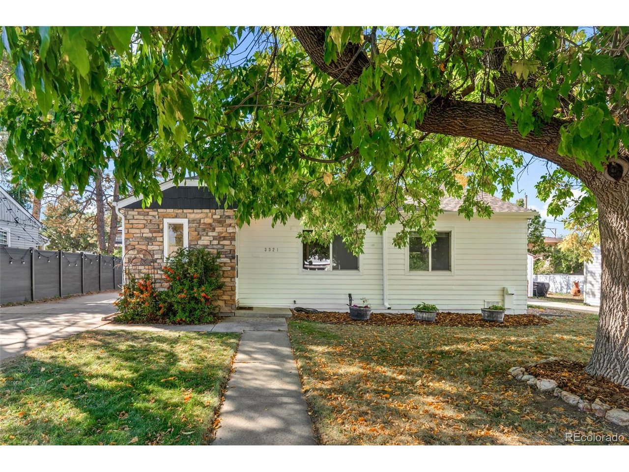 Experience Effortless Living in University Hills! Welcome to this inviting, updated ranch home offering the perfect blend of comfort, style, and versatility in a desirable Denver location. Step inside to a spacious living room where an expansive picture window fills the space with natural light and a cozy wood-burning fireplace creates the perfect spot to gather on chilly Colorado evenings. The gorgeous chef's kitchen, complete with stainless steel appliances, is ready for everything from everyday meals to culinary adventures, while the adjoining dining area offers plenty of room for entertaining family and friends. Refinished hardwood floors, fresh interior paint, four generous bedrooms with walk-in closets, and two full bathrooms make this home as functional as it is welcoming. Need extra space? The detached ADU with mini split (no plumbing)opens up exciting possibilities for a home office, creative studio, golf simulator, or your own dedicated hobby space. Set on a generous quarter-acre lot, the landscaped backyard is an outdoor retreat featuring a large patio perfect for summer barbecues, relaxing evenings, and gatherings with friends, plus a handy storage shed. An oversized detached one-car garage and additional driveway parking for two vehicles add even more convenience. With four bedrooms when including the ADU, flexible spaces to fit your lifestyle, and a fantastic University Hills location, this home offers room to live, work, entertain, and make yourself at home. Come see all the possibilities waiting for you!