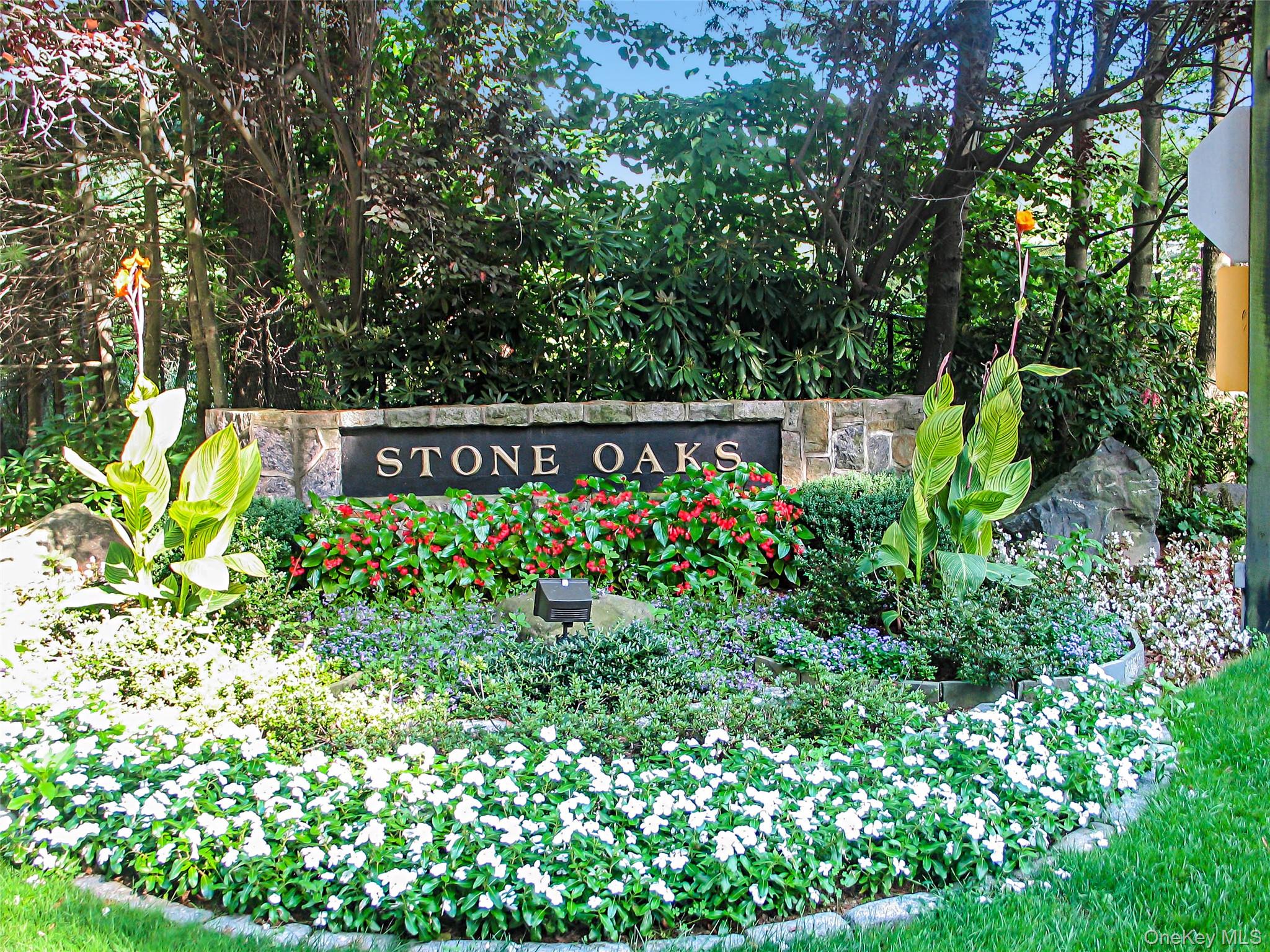 A great opportunity! This coveted two bedroom, two level layout is infused with light and possesses incredible flow and versatility. This model boasts a modern layout providing a perfect canvas for any aesthetic. The entry foyer provides an expansive view of the first floor open floor plan. A combined dining room/living room occupies the entire back of this first floor with a fireplace and sliding glass doors to a large deck. With sophisticated furnishings and striking artwork, the space has been stunningly transformed, and undeniably chic, as evident in the listing photos. Other special features include: a big eat-in kitchen with a wall of glass; an exposed staircase to the second floor; and a first floor den/guest room with laundry. The primary bedroom features a walk-in closet, a primary bathroom and a large storage attic. A second bedroom (can also be used as the primary) features: double exposure, walk-in closet, and a bathroom featuring a skylight. Stone Oaks is a 145-unit Westchester townhouse complex uniquely designed in clusters of not more than 4 townhouses, beautifully sited on 42 woods acres providing rare privacy amid sprawling green spaces. Amenities include: a 24-hour occupied gatehouse, pool, tennis and pickle ball courts, fitness center and clubhouse. 35 minutes to New York City. The Offering Plan states a gross square footage of 2,248 for this unit. A must see!