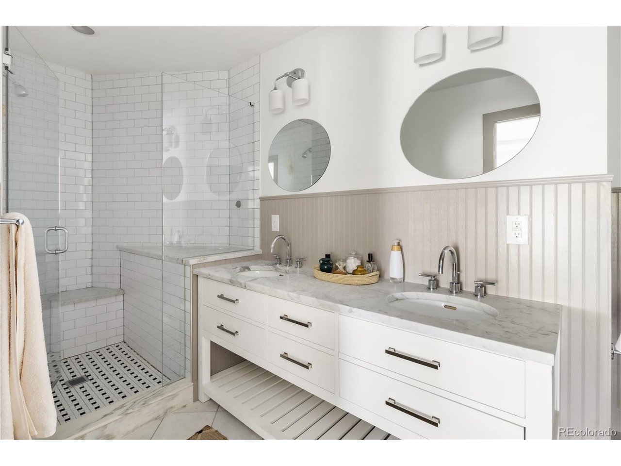 Located along a quiet stretch of 16th Avenue in South City Park, this home earns its character honestly. Original windows frame light at every hour, and the craftsmanship is the kind developers and flippers no longer value. The floor plan flows naturally from a generous living room through a defined dining space and into the kitchen, with a half bath, pantry, and large closet that address storage needs. Upstairs includes two ensuite bedrooms with a sunlit landing between them that can serve as the perfect desk or reading nook. The fully finished basement spans the footprint of the property and includes another full bathroom to accompany a potential third bedroom or offering flexibility for guests, hobby or workspace. Have your morning coffee on the east-facing front patio, waving hello to your friendly neighbors. Spend evenings in the beautifully landscaped west-facing backyard anchored by a mature ash tree that perfectly shades the roof from strong afternoon sun. Situated just one block between City Park and the greatest stretch of East Colfax, you have the best of city living at your doorstep. Bakeries, bars, restaurants and iconic Denver destinations are all within walking distance. This is a rare address where the neighborhood quality, character, and history match the home.