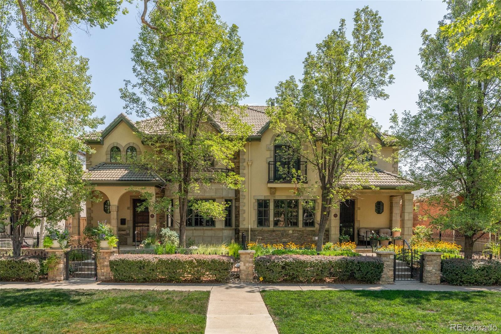 This gorgeous remodeled Cherry Creek North duplex townhome with a three-car garage and a discreet elevator connecting all three levels, strikes the perfect balance between warmth and polish. Wide-plank hardwood floors ground the main level, where a handsome private study with a beamed ceiling, gas fireplace, and floor-to-ceiling custom built-ins sets an immediate tone of intention and craft. The living room fireplace tile wall and kitchen were reimagined in 2024, hits every note with stainless steel appliances that include a beverage fridge, a Bosch Benchmark dishwasher (2025) and Kitchenaid refrigerator (2023). Upstairs, the primary suite is fitted with a cozy gas fireplace, a beautifully remodeled five-piece bath, and a custom walk-in closet. A second ensuite bedroom serves guests with equal thoughtfulness. The lower level adds real flexibility — a spacious great room, a full wet bar, and a third ensuite bedroom. In 2026 updates include a new attic furnace, new carpet, four bathrooms remodeled (the fifth/main level powder room in 2024), and a Wolf microwave. Also added are a Goodman AC unit (2024), Lennox AC (2018), basement furnace replacement (2022), new 50-Gal Water Heaters (2) w/ recirculating hot water (2019). Outside, the private courtyard is upgraded in 2014 with new flooring, a built-in firepit, grilling station, and outdoor refrigerator — giving the home an outdoor entertaining setup that punches well above its size. 544 Adams Street is the rare Cherry Creek North offering that will catch your eye and your heart. Meticulously cared for and built around a lifestyle that values both connection to the city and find a sanctuary away from the bustle. Welcome home!