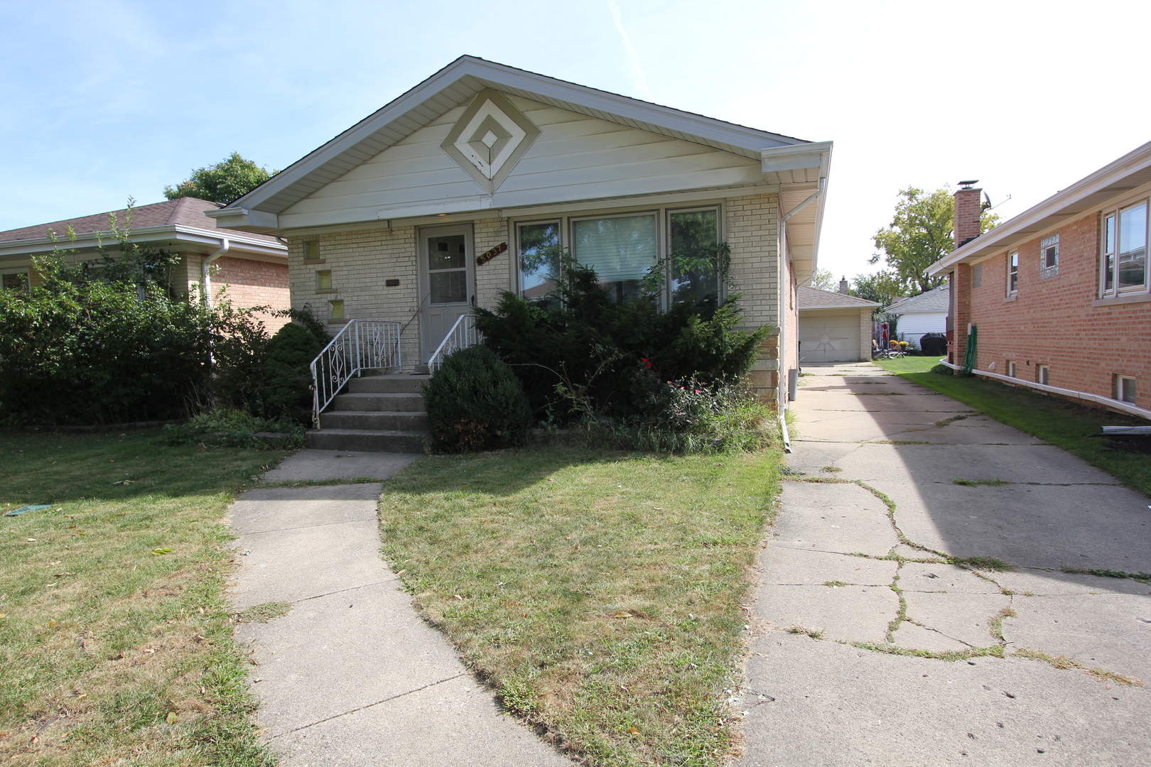 Very nice brick ranch with side driveway and detached 2.5 car garage.Located near major shopping centers, blue line transit and highway.Property needs some updating.Central AC from 2022. If you are ready for an investment or a family nest this property will be it. Property sold AS IS condition.
