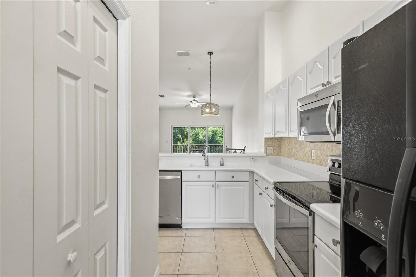 Experience elevated coastal living in this top-floor 2-bedroom, 2-bathroom condominium offering high ceilings, many modern updates, and peaceful views of the Intracoastal Waterway. Newly refreshed with paint, upgraded lighting and ceiling fans throughout, new appliances, a stylish kitchen backsplash, and upgrades to both bathrooms. This home blends comfort with contemporary appeal. The bright, open layout flows effortlessly to a private lanai where you can enjoy gentle breezes and tranquil water views. A beautifully updated residence in a serene waterfront setting. An amazing array of amenities makes this the perfect location, including a clubhouse, pool, spa, fitness center, pickle ball, miles of walking/jogging/biking paths, kayaking, and easy access to the beach which is less than a mile away.
