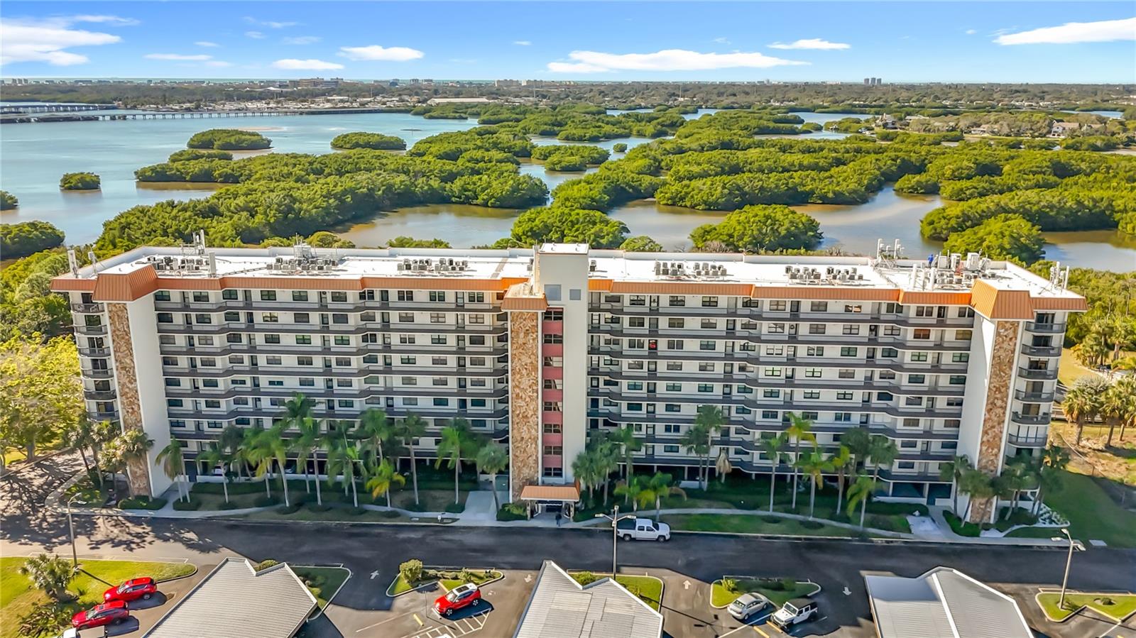 Located on the 6th floor at Otter Key Condominiums, this 2-bedroom, 2-bath residence at 5400 Park St N offers an easy, low-maintenance way to enjoy St. Petersburg and the Florida lifestyle.  Elevator access makes coming and going simple, and your screened balcony provides an amazing view of Cross Bayou.  Inside, the layout is functional and comfortable, with an updated kitchen featuring white cabinetry, a farmhouse sink, and a striking backsplash. The primary bedroom has a large walk-in closet and is adjacent to a remodeled bathroom with a walk-in shower.  The primary suite also has sliding glass door access leading to your screened-in balcony!  The second bedroom is spacious and can double as an office or guest room.  This unit has NO carpet, offering hard-surface flooring throughout making it easy to keep clean and maintain.  Condo fees simplify your monthly expenses by including key utilities and services: internet, gas, water, trash, sewer, and pest control.  Otter Key’s amenities include a community center with a fitness room, pool table, table tennis, heated pool, two tennis courts, and a nature boardwalk.  Shopping is a pleasure with a Publix supermarket located within walking distance, across the street.  Conveniently located near shopping, restaurants, medical facilities, major roadways, as well as the fabulous bay area beaches.  Schedule your private showing today.