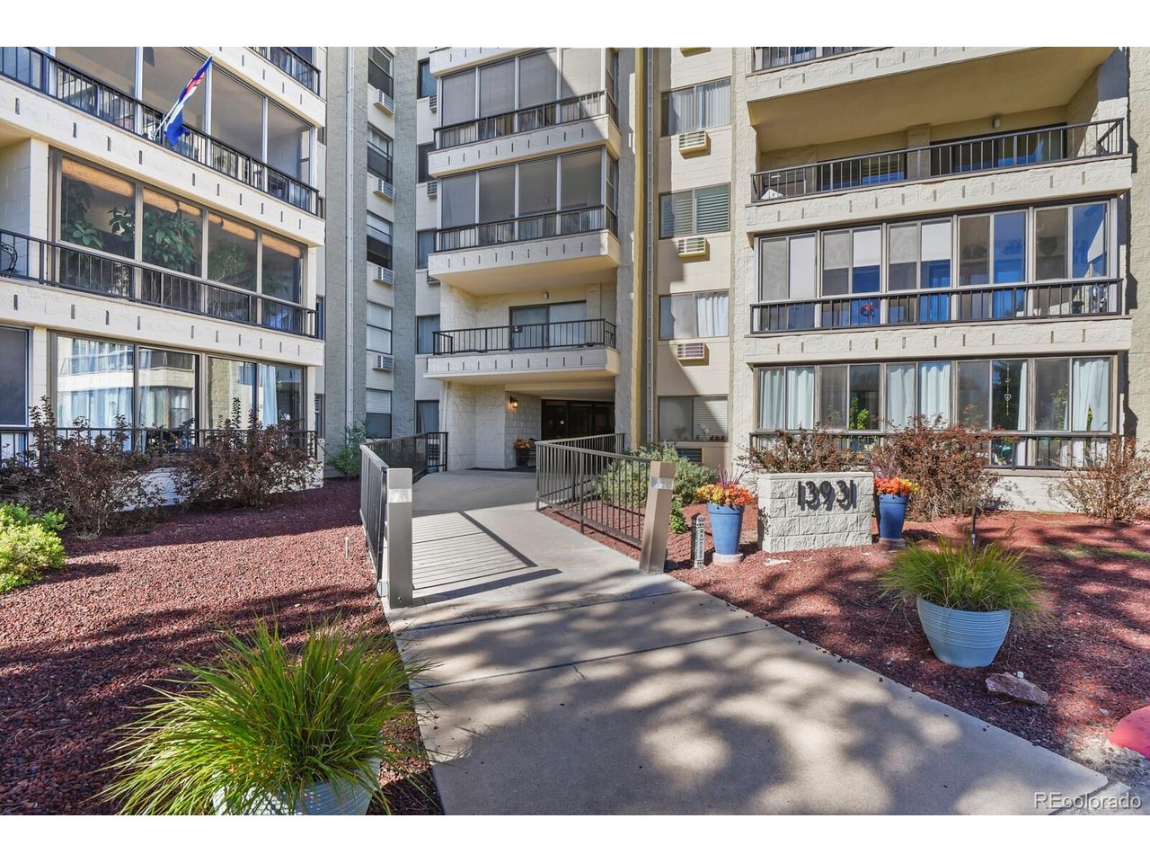 Fabulous Penthouse Unit in an Atrium Building-Heather Gardens' residential gems and just a 5-10 minute walk to the Golf Course, Rendezvous Restaurant, and Clubhouse. This beautifully remodeled 2-bed, 2-bath condo blends modern luxury with thoughtful design. The open kitchen and great room create an ideal space for entertaining and everyday living. The chef's kitchen features updated maple cabinets, soft-close doors, quartz counters, modern tile backsplash, stainless BOSCH appliances.   Light flows through the energy-efficient Anderson patio door and window leading to the spacious fully enclosed sunroom/lanai off of the great room. Swedish Ash Wood flooring, unifying the spaces and making for easy cleaning.  Both bathrooms offer spa-like finishes with upgraded tile, counters, and lighting. The en-suite primary bedroom includes generous walk-in closet and enclosed sunroom/lanai.  This is a rare floorplan, with the secondary bedroom on the opposite side of the living room from the Primary Bedroom.   This 2nd bedroom works beautifully as an office or hobby room if desired. The laundry room includes a large washer/dryer set and ample storage. Quality is evident everywhere-newer doors, hardware, lighting, windows, electric panel, appliances, cabinets, flooring and much much more. Beautiful views.  In the secure underground garage, enjoy Parking Space #2C and also parking space #76.  TWO underground parking spaces!  one Cowboy locker. Heather Gardens is a vibrant 55+ community.  Countless amenities, clubs, and activities are right outside your door. This beautifully remodeled and cared for home is ready for you-Welcome Home!