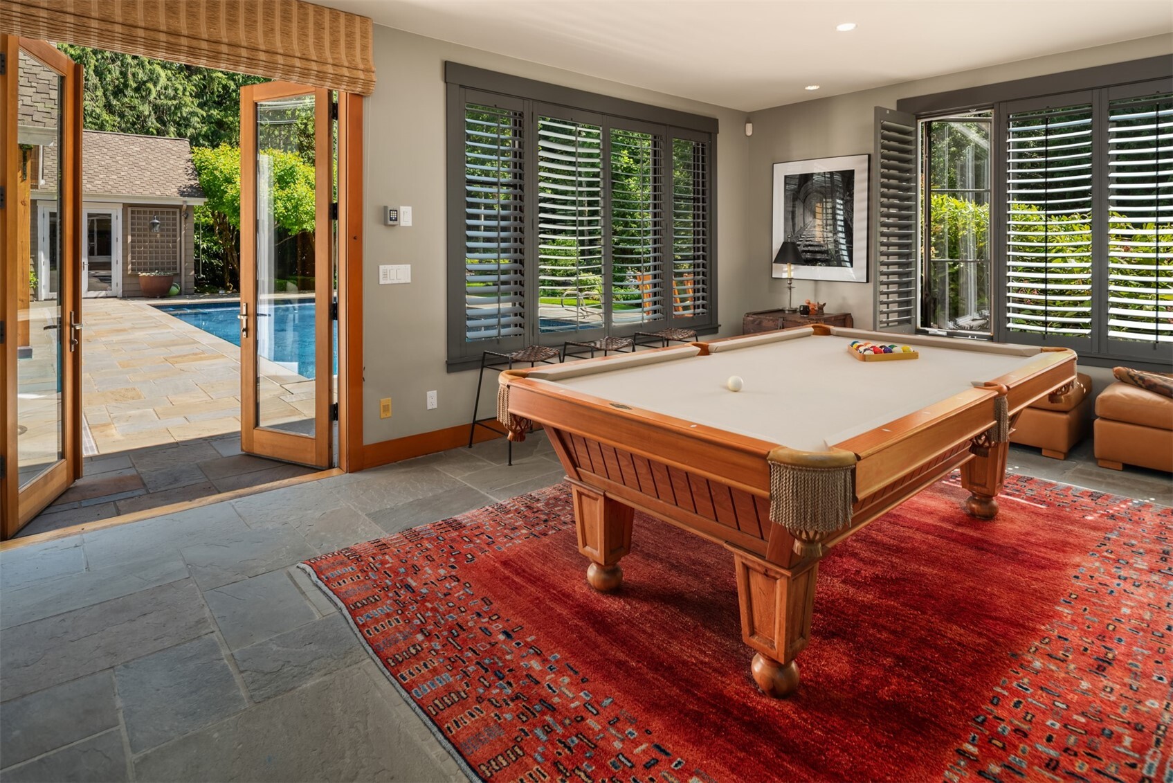 Game room with pool table and French doors to pool patio