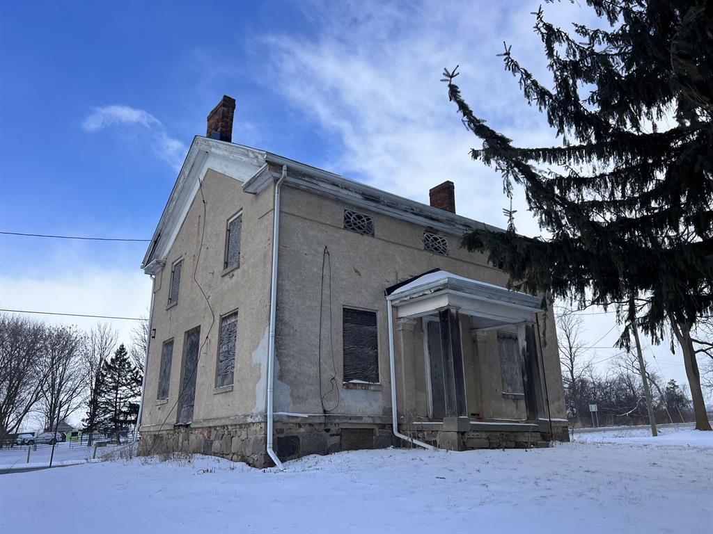 Own an iconic piece of architectural history--the oldest known structure in Lodi Township. This Greek Revival brick building with a stucco exterior is believed to have been designed by Stephen Mills circa 1826, and was certainly constructed prior to 1856. Prominently positioned at the highly visible intersection of Ann Arbor-Saline and Wagner Roads, the property has stood as a landmark for nearly 200 years.Commanding this historic crossroads, the structure has long captured the attention of all who pass by and is widely recognized throughout the community. Its strategic location and enduring presence have led to speculation that it once served as a toll booth, further adding to its unique historical character.Well known by thousands of daily travelers, the property offers exceptional visibility and endless potential for a variety of future uses. This is a rare opportunity to reimagine a celebrated landmark and bring new purpose to a property that has been central to the area'sarea's story for generations.