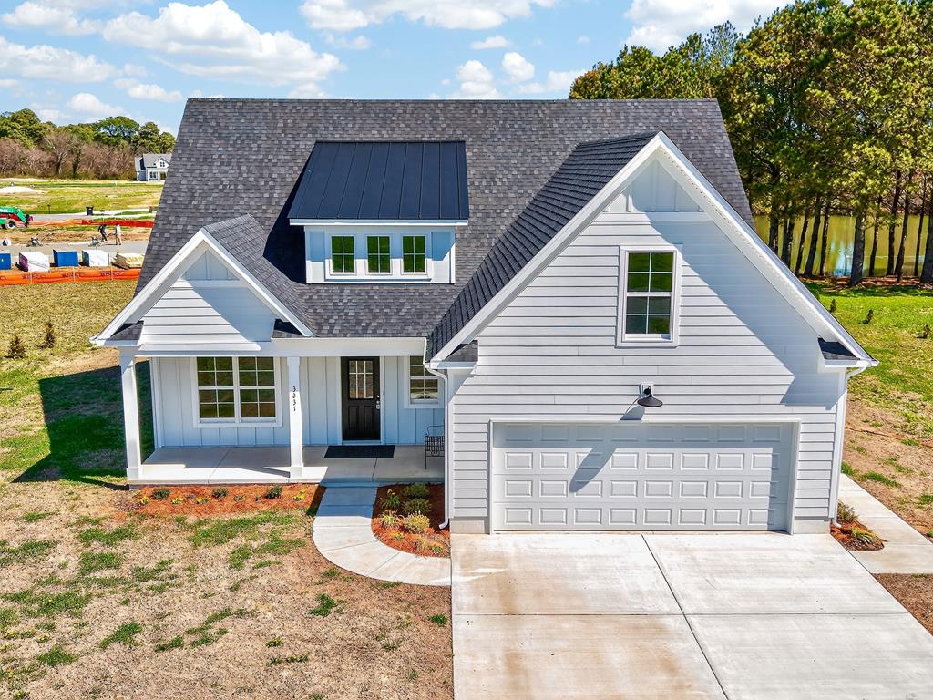 Welcome to this beautiful home in Tower Hill Estates offering 2,342 square feet with 4 bedrooms and 3 full baths. This two story home features an open concept layout filled with natural light from abundant windows throughout. The main level includes a primary suite with direct access to the covered back porch, creating a private retreat with peaceful pond views. The living room features sliding glass doors that lead to the covered back porch, perfect for relaxing or entertaining. Enjoy both covered front and back porches for added outdoor living. With additional bedrooms and space upstairs, this home offers flexibility for a variety of needs. Located just outside Cape Charles, enjoy easy access to this sought after beach town known for its charm, dining, and coastal lifestyle.