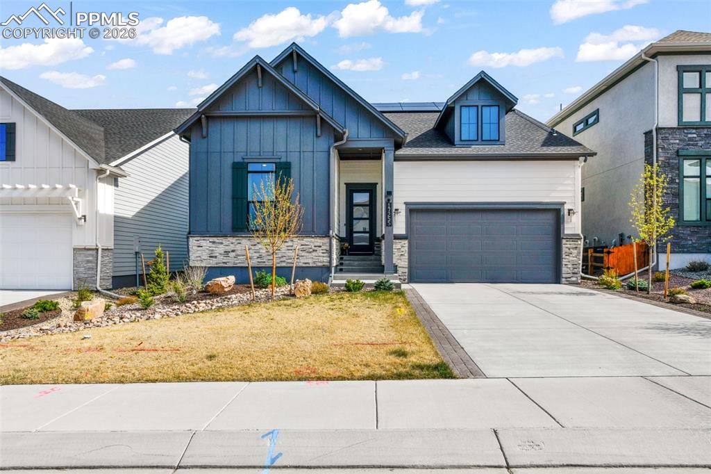 Beautifully designed and better than new, this stunning ranch-style home in Monument’s desirable Cloverleaf community offers the perfect blend of modern elegance, thoughtful design, and effortless Colorado living. Built in 2024 by David Weekley Homes, this home showcases quality craftsmanship, upgraded finishes, and a highly functional layout with over 3,200 finished square feet.  From the moment you step inside, you’ll be welcomed by an open and airy floor plan filled with natural light, warm luxury vinyl flooring, and a spacious great room anchored by a cozy gas fireplace. The gourmet kitchen is truly the heart of the home, featuring quartz countertops, a large center island, gas range, stainless steel appliances, and abundant cabinetry, all flowing seamlessly into the dining area and living space for easy entertaining.  The main level offers true ease of living with a private primary suite designed for comfort, complete with a walk-in closet and a beautifully appointed spa-style bath with dual vanities and a walk-in shower. An additional bedroom and dedicated office/craft/dining on the main level provide flexibility for guests or work-from-home needs, along with convenient main-level laundry. The finished basement expands your living space with a large family room, bathroom, wet bar, two additional bedrooms, and generous storage, creating the perfect setup for entertaining or multi-generational living.  Step outside to enjoy a low-maintenance yard and outdoor living space all set within a growing community near parks, trails, and top-rated Lewis-Palmer District 38 schools. Additional features include solar, central air, this move-in ready home offers the perfect combination of style, space, and location in one of Monument’s most sought-after neighborhoods.