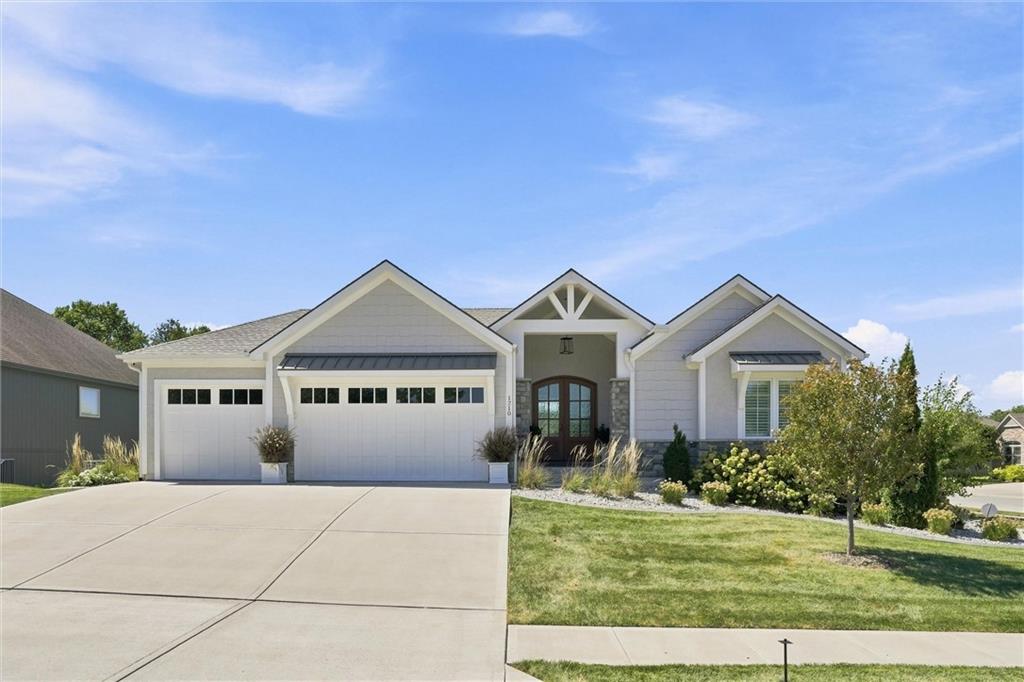 Welcome to 1210 Metfield Ln, an extraordinary residence set on a pristine corner lot in Raymore’s premier Creekmoor community, designed for luxurious comfort and seamless entertainment. Situated directly on the green of Hole #2, this exceptional home features four spacious bedrooms, a versatile fifth non-conforming room, and five full bathrooms to offer unmatched flexibility and privacy for family and guests alike. The interior is fully upgraded with striking custom lighting fixtures and integrated power shades, while a light-filled all-seasons room complete with its own fireplace provides a cozy front-row seat to the golf course year-round. Step outside to a covered outdoor living space featuring motorized power screens that let you take in the panoramic views in complete comfort, completing a remarkable blend of high-end custom detail and serene indoor-outdoor living.