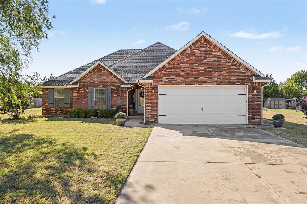 Set on a spacious lot in Edmond, this well-appointed 3-bedroom, 2-bath with an office ranch offers 1,800 square feet of thoughtfully designed single-level living. The split floor plan provides a comfortable sense of separation, while the kitchen features a breakfast bar, pantry, dishwasher, disposal, and electric range and oven. The inviting living room showcases a masonry fireplace and ceiling fan, complemented by a dedicated dining area for everyday meals or entertaining. The primary suite features an attached full bath with double vanities, a tub and shower, and a generous closet. Bamboo flooring was added around 2020, and a new hot water tank was installed in 2025. Additional interior features include painted woodwork, window treatments, and a blend of wood, tile, and carpet flooring. Outdoors, the covered patio, porch, and large masonry fire pit create an ideal setting for enjoying the expansive grounds. An attached two-car garage and concrete driveway provide convenient parking, while a private well and aerobic system serve the property. Located within the Edmond school district near Heritage Hills Elementary, Sequoyah Middle School, and Edmond North High School. Don’t miss out on the rare combination of a spacious lot, brick construction, flexible 4-bedroom layout, and inviting outdoor spaces—see how this Edmond property fits your lifestyle in person.