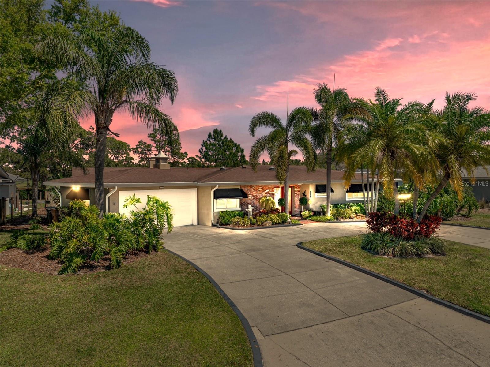 LUXURY GOLF COURSE LIVING awaits with this beautifully updated estate home, ideally situated on the 5th fairway of the Pelican Golf Course, offering stunning views and serene Florida sunrises. From the moment you arrive, you are greeted by the home's charming exterior, vibrant landscaping, and a circular driveway that sets the tone for the exceptional spaces inside.
Step into an open and bright floor plan designed with both style and functionality in mind. Soaring vaulted ceilings, with exquisite wooden beams and oversized windows throughout, fill the home with warm and natural light.
At the heart of the home is the spacious kitchen, complete with beautiful maple cabinetry, SS appliances, and an expansive breakfast bar. The walk-in pantry ensures ample storage, while the intimate cafe nook offers a charming setting for casual dining. Directly off the kitchen is a private courtyard, fully fenced for added privacy (NEW PVC FENCE, April-2025). This peaceful outdoor space, accessible from both the kitchen and primary suite, offers a secluded escape perfect for enjoying your morning coffee or simply relaxing outdoors.
Just beyond is the dining room, complete with a built-in wet bar, beverage refrigerator, and additional bar seating. It provides the ideal setting for both intimate soirées and grand celebrations. Adjacent to the dining room is a tranquil alcove that offers a cozy space to unwind. The family room showcases a magnificent stone fireplace providing an inviting space for conversation or relaxation, with large windows framing sweeping views of the golf course that brings the outdoors in.
The primary suite is thoughtfully positioned on the left wing of the home, ensuring maximum privacy. This luxurious retreat boasts oversized windows, dual closets (A custom Walk-Through closet & an additional spacious custom Walk-In closet with direct access to the courtyard), and a beautifully renovated ensuite bathroom. This luxurious ensuite features a sleek, freestanding soaking tub, dual vanity sinks, and a generously sized walk-in shower, providing a true sanctuary.
Three secondary bedrooms: The front bedroom is appointed with custom built-in dresser drawers and a custom walk-in closet, that share a charming Jack-and-Jill bath with the second bedroom. The third bedroom, located at the rear of the home, is oversized and host 2 closets. Although, it is currently being used as a cozy den it could easily function as a second primary suite or an in-law suite, with a full bath that is just steps away.
The private backyard oasis is encased by a charming white picket fence and offers panoramic views of the fairways. This quiet haven offers the perfect setting for both grand gatherings or just watching golfers pass by. 
**NOTABLE MENTIONS: This home sits 45+ feet above sea level, NO FLOOD ZONE, NO FLOOD INSURANCE REQUIRED, Situated on the 5th Fairway, Double-Pane Windows, Storm Shutters, Plantation Shutters/Honeycomb Blinds, Electrical Panel Wired for a Generator, NEW A/C (2023), NEW Roof (April 2025), NEW PVC Fence (April 2025), NEW HOT WATER HEATER (April 2025), Workshop & ½ Bath in Garage, & so much more!
Call today for a private tour of this exquisite, 'worry free--stress free' home and start enjoying all the amazing things that Belleair has to offer. Just around the corner from the prestigious Pelican Golf Country Club, sugar-white Gulf beaches, fine dining, fabulous boutiques, and just a few minutes from Tampa International Airport.