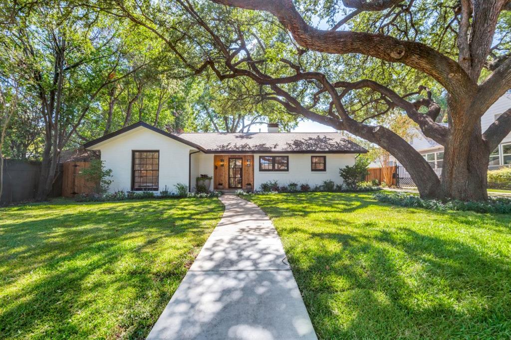 Timeless character meets modern luxury in the heart of Fort Worth's highly sought after Berkeley Place. Beautifully reimagined and completely renovated with exceptional designer finishes, this stunning property blends historic charm with sophisticated modern living. Situated on an oversized, nearly quarter of an acre lot with an unforgettable oak tree as well as professional landscaping featuring Texas native plants.  The modern steel and glass door, along wall of windows flood the entire living spaces with beautiful natural light, creating an atmosphere of warmth and understated luxury. Gorgeous white oak hardwood flooring, elegant designer lighting, and high-end fixtures complement the home's architectural character. The show stopping kitchen features exquisite Taj Mahal countertops and backsplash, professional grade Frigidaire appliances, wine cooler, custom cabinets, and handcrafted unlacquered brass imported from Morocco. Banquette seating with built ins provides a perfect eat in kitchen. Both bathrooms showcase organic natural marble, limestone, and antique brass creating a timeless, spa inspired experience. Thoughtful improvements include removal of attic insulation and installation of 16 inches of new blown-in insulation for comfort and efficiency. Berkeley Place is truly one of the best neighborhoods in Fort Worth, with tree lined streets, neighborhood events, and a tight sense of community. Walking distance to the highly regarded Lily B. Clayton Elementary school. Minutes from Downtown, Cultural District, Stockyards, TCU, Southside Main, and Medical District. Turnkey experience, all furniture, furnishings, and designer décor are negotiable to convey. Every space has been thoughtfully curated, offering the rare opportunity to purchase a beautifully finished and furnished home. An exceptional opportunity to own a truly distinctive Berkeley Place residence where historic character, designer craftsmanship, and modern luxury come together effortlessly.