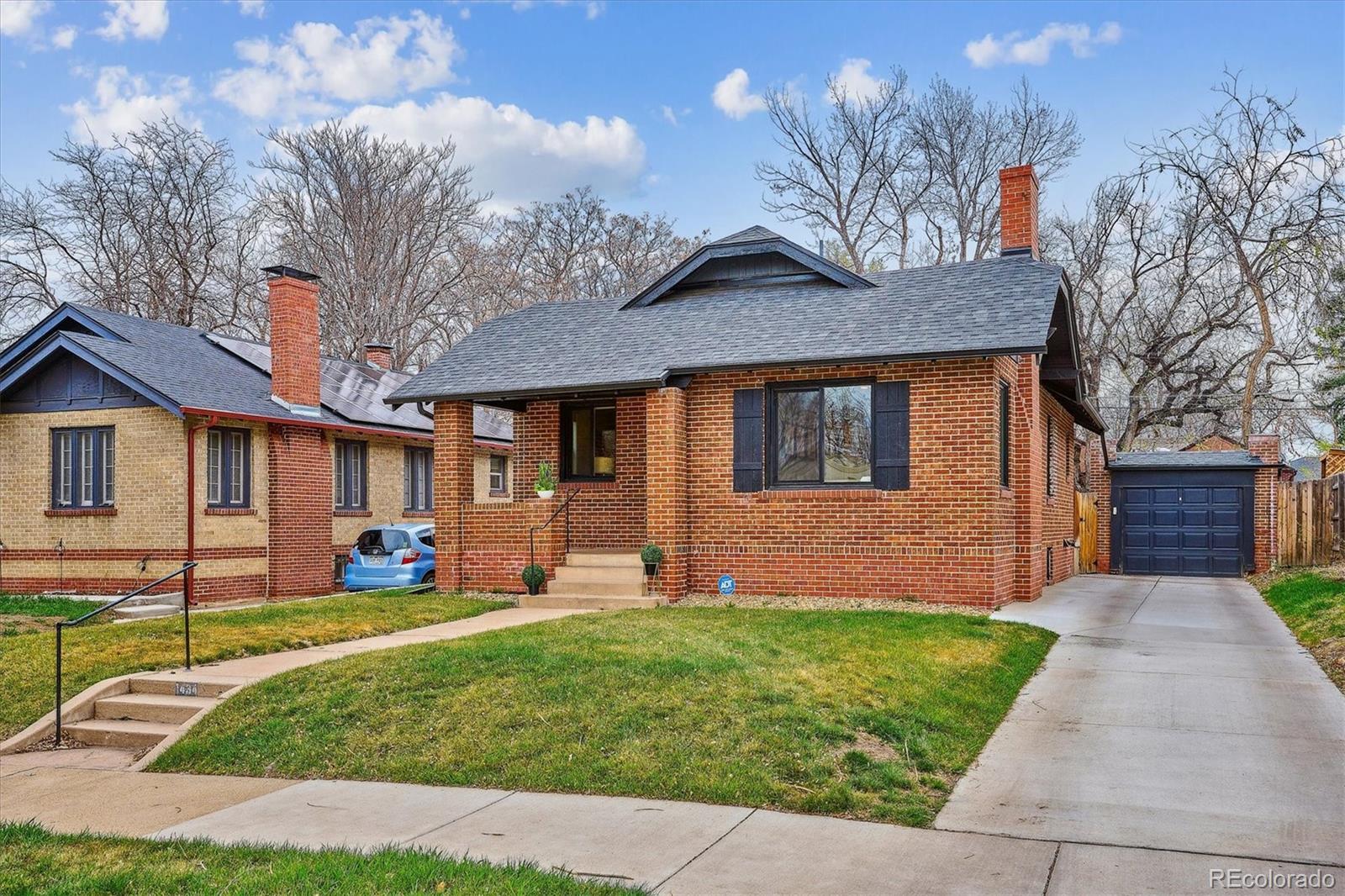 This handsome brick bungalow with a delightful front porch is fully updated, remodeled, well-maintained and cherished, this home is gorgeous. An open floor plan with exposed brick and a stunning kitchen greet you when you enter. Tall Shaker cabinets, drawers with dove-tail joinery and soft close, upgraded SS appliances, kitchen island, and other luxury touches create a perfect workspace for crafting culinary masterpieces. Sit by the fire and engage with your friends and family. A little back foyer with room for cubbies gives you a place to remove your shoes and hang your coat when you enter from the garage. And best of all, enjoy a primary bedroom, walk-in closet, and en-suite bath on the main floor! A second room on the main floor can double as a bedroom or an office. And how nice for entertaining - a 1/2 bath on the main floor! The basement has two add'l bedrooms with nice closets and full egress windows at garden level for natural light. The full bath in the basement is spacious and attractive. Find plenty of room in the great room for a sectional and large television around the built-in corner fireplace. This house was fully remodeled in 2020 - new electrical, plumbing, mechanical systems, roof, gutters, windows, kitchen, baths and interior finishes - all to exacting standards, with Denver permits! New central air and whole house air purifier added in 2021. The new windows on the main floor all have custom top/down, bottom up shades installed - the basement has custom bottom up shades. New sprinklers in the front and the back keep the landscaped yard looking good. Walk to the best fish in town at Town and Country Market, or take a quick trip to Marzczyk's Fine Foods and Wine just a few blocks in the other direction.  Also on Colfax, one block north, enjoy Lilac Coffee Benzina, Viva, City Donuts, The Abbey and Nuggs. The excellent theater at 9th and Albion is an easy walk, as is Trader Joe's, Snooze, Le French, and Frank and Roze - just to name a few.