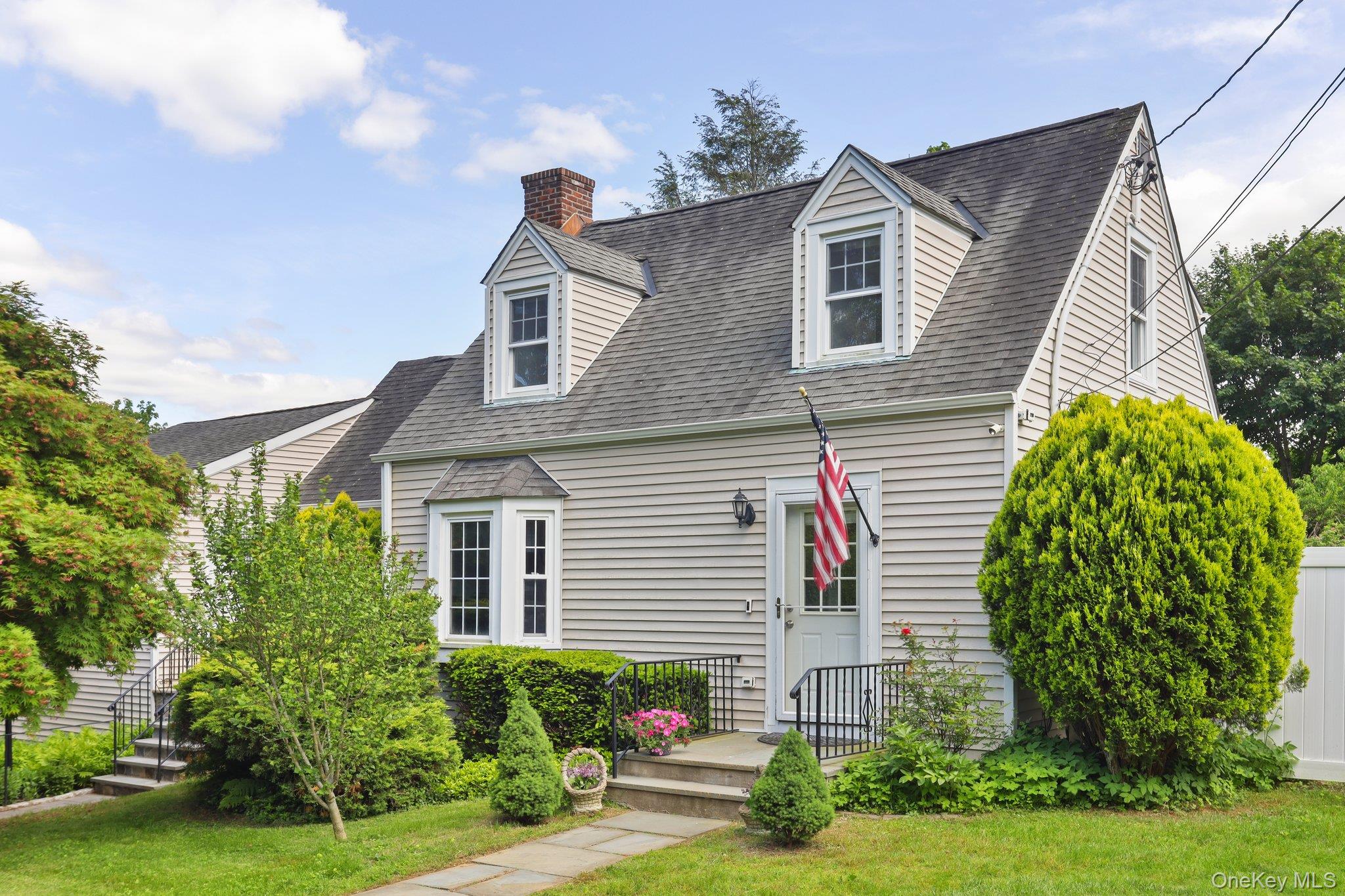 Welcome to 11 Brundage Street — a charming & thoughtfully updated home nestled in the heart of Armonk & located within the Byram Hills School District. Ideally situated just moments from the shops, dining, & amenities of downtown Armonk, this move-in ready gem offers the perfect combination of comfort, style, & versatility. Step outside to a large, sunny deck—perfect for outdoor entertaining—overlooking a private, level, & fully fenced backyard. A delightful, mostly finished outbuilding offers endless potential: create your dream home office, art studio, workout space, or use it however you imagine. Inside, the home is filled with natural light & features well-proportioned, inviting rooms throughout. The main level includes a spacious living room (built in 2003) with cathedral ceilings, a cozy gas fireplace, a full bathroom, & a second private entrance—ideal for guests, play, or work. The updated eat-in kitchen (originally built in 1983) is both functional & beautiful, with a large bay window overlooking the backyard, granite countertops, a center island, floating shelves, & newer stainless steel appliances—including a gas range with pot filler, refrigerator, microwave drawer, & dishwasher. A wet bar with a second sink & wine fridge makes entertaining a breeze. Also on the main floor: a formal living/dining area, a flexible room perfect for work, play, or use your imagination, a stylishly renovated powder room, & a custom mudroom with built-ins & direct access to the deck & backyard. Upstairs you'll find two comfortable bedrooms, a full hall bath, & an additional bonus space off one bedroom—perfect as a nursery, office, walk-in closet, or playroom. Additional highlights include: gleaming hardwood floors recently refinished throughout, central air conditioning throughout & additionally to two ductless split units upstairs, a full walk-out basement with three large unfinished rooms offering incredible potential including a newer electric panel, & beautiful specimen plantings, two garden beds, & mature fruit trees. This home is truly a rare find—offering privacy, flexibility, & room to grow, all in a prime Armonk location. Don’t miss the chance to make 11 Brundage Street your home! 1,483sf is finished space plus an additional 1,302sf including the basement & the Outbuilding. Tons of potential! Generator included.