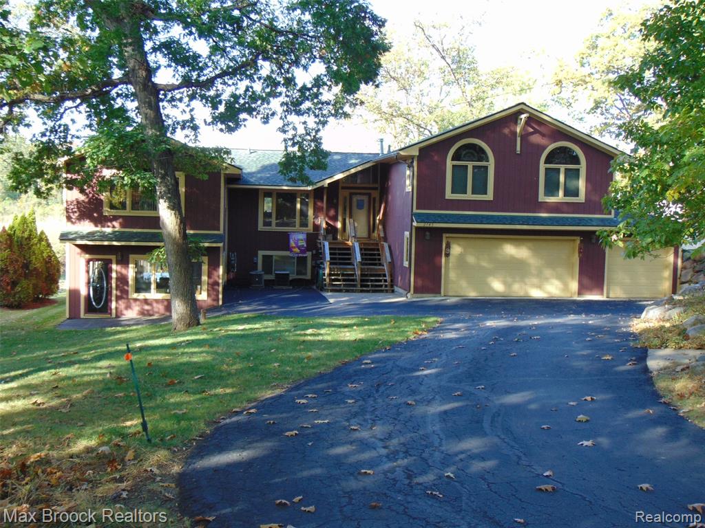 ***** OPEN HOUSE SUNDAY, October 26th from 2:00am until 4:00pm******Cass Lake Retreat – A Unique Lakefront Gem! This exceptional property offers 5,000 sq ft of living space on nearly 3/4 of an acre, with breathtaking scenic views of Marshbank Park that provide the perfect backdrop for relaxation and recreation. Featuring 4 spacious bedrooms, including a primary retreat with custom wood accents and radiant floor heat in the primary bath. This home is designed for comfort and luxury. The expansive 800 sq ft art studio provides endless possibilities and includes radiant floor heat throughout. Whether you’re looking for a creative space, a private apartment, or an in-law suite – the choice is yours. Additionally, a large bonus room off the fourth bedroom boasts over 500 sq ft of finely crafted woodwork and large windows, offering a bright and inviting atmosphere. Recent Upgrades Include: Deck-2022, Roof by Spencer(50 Year)- 2021, Lenox Furnace- 2023 Radiant Floor and Baseboard Heat/High Efficiency Boiler Systems(maintenance contract with Trzos), Newer LG Washer & Dryer to stay, A/C- 2019, Refrigerator- 2023, & 200AMP Electrical Service with stand alone generator transfer box.  Cathedral ceilings, Custom Windows(Casement) Velux Skylights, 6 inch framed wall and wood sided construction fully insulated energy efficient design. Terrace level of studio to premium brick paved patio(PMS we are the guys) gardens and dock with 130 feet waterfront on canal to cass lake. This gorgeous home will leave you breathless! Don't miss out on this rare opportunity!