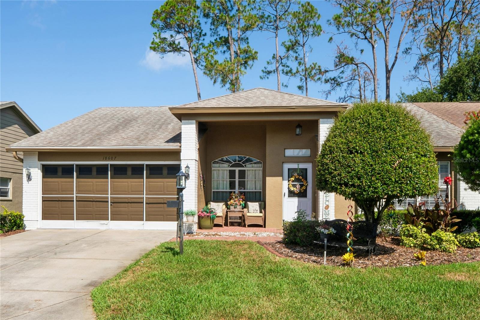 Stunning Golf-Course Villa in Heritage Pines! Experience carefree Florida living in this beautifully maintained end-unit villa, perfectly positioned to capture serene golf course views on the 13th fairway with no rear neighbors. This spacious home features two bedrooms, two bathrooms, a sitting room, and a two-car garage.Step inside to formal living and dining rooms, ideal for entertaining. The open eat-in kitchen overlooks the inviting family room, creating a comfortable and functional layout. The primary suite offers peaceful views along with an en-suite bathroom featuring dual sinks, sun tube and a walk-in shower. A private guest bedroom and adjacent hall bath with a sun tube provide the perfect space for visitors.Additional highlights include an inside laundry room and a versatile den/sitting room—perfect for a home office or hobby space. No carpet all tile. Relax on the back patio and enjoy tranquil golf course views in your own private retreat.