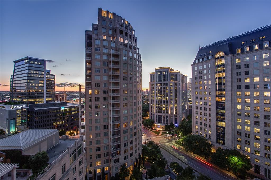 Urban chic meets Ritz-Carlton prestige & legendary service in fashionable Uptown.  This one-of-a-kind residence has been beautifully RENOVATED in soft tones, offering a timeless style wrapped in lush treetop views.  A rare corner unit, it features 2 Bedrooms plus a Study that doubles as a 3rd sleeping area.  A dramatic rotunda Foyer sets the stage, leading into expansive Living–Dining–Sitting areas that flow seamlessly to a double balcony perfect for enjoying morning coffee or sunset cocktails.  Wood & stone floors, soaring 10’ ceilings, four-piece crown moldings & a marble fireplace with custom built-ins add elegance & style.  The Living Room has a perfect space for a baby grand piano, while the Dining Room easily accommodates a large family-sized table & sideboard.  The chef’s Kitchen is outfitted with marble counters, elegant backsplash, an island with a breakfast bar, Wolf & Sub-Zero appliances, two wine refrigerators, an ice maker & dual pantries.  The oversized Primary Suite offers three closets & a marble, spa-inspired Bath with jetted garden tub, seamless rain shower, dual vanities & private water closet.  The Guest Wing features a tranquil Bedroom overlooking a pocket park, ensuite marble Bath & luxurious Powder Room.  Life at the Ritz means legendary five-star hotel service & amenities: Concierge, Valet, Bellman, Room Service, Wine Room, Conference & Club Rooms, resort-style Pool with spa, fireplace & grills, Fitness Center & Pet Park.  Relax in the healing waters, get a massage, a facial, a mani-pedi and a haircut at the full-service 12,000 sq ft Ritz-Carlton Spa.  Dining is world-class, from Fearing’s Restaurant & Bar & the alfresco Live Oak Bar with live music on occasion.  All of this in Dallas’ most walkable neighborhood—steps to Klyde Warren Park, The Crescent, American Airlines Center, Victory Park, the Design Center, CBD, the #1 rated largest contiguous urban Arts District in the US, & Dallas' finest shopping, dining & entertainment venues.