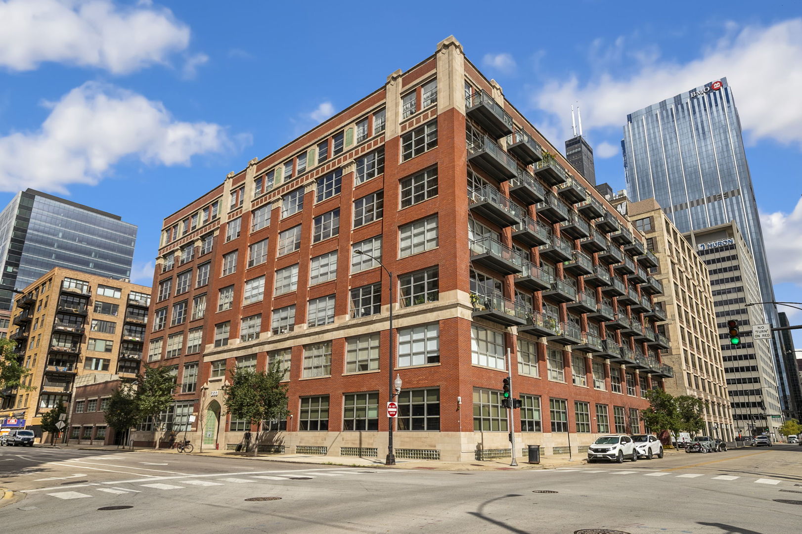 Stunning 3Bed/2Bath West Loop condo! This oversized, just repainted loft spans nearly 1,900 square feet and is packed with character and modern updates. Soaring 10' ceilings, timber ceilings, brick detailing, expansive southwest-facing windows, and newly refinished hardwood floors (2025) set the stage for an airy, light-filled home. The open living space is anchored by a cozy fireplace and flows effortlessly into the dining area and beautiful kitchen. A true showpiece, the kitchen features granite countertops, new backsplash (2025), all new stainless steel appliances (2025), abundant storage, and a massive island perfect for entertaining. Step outside to your private deck for grilling or soaking in the urban landscape. All three bedrooms are fully enclosed with oversized windows. The primary suite is an absolute standout-room for a king bed, a large walk-in customized closet, a spacious bath with dual granite vanities, steam shower, and soaking tub. Laundry room has brand new washer & dryer as well as storage. New AC & furnace in 2021. Additional storage locker and one deeded garage space included (with second spot available for $30,000). Building amenities has a fitness room and is in a great location near the Loop, Union Station, Ogilvie, the "L," and the city's best restaurants/nightlife.