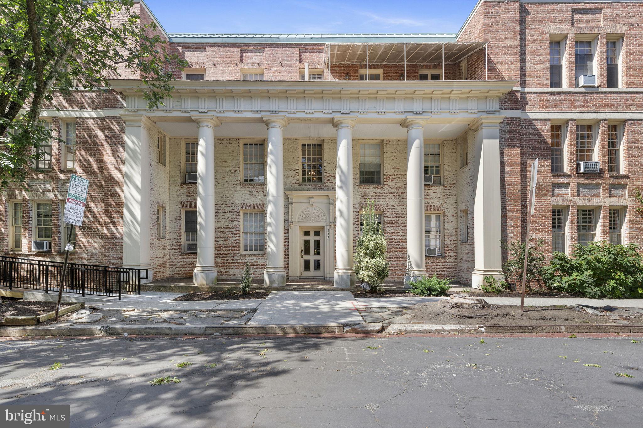 Nestled in historic Tuscany-Canterbury, this top-floor 1910 Beaux-Arts penthouse is a stunning example of classic period craftsmanship. Spanning 1,625 square feet, the open, light-filled layout flows from a grand foyer into expansive living space accented by soaring ceilings, crown molding, arched doorways, and rich hardwood floors throughout. At the heart of the home, a cozy wood-burning fireplace provides the perfect focal point for cool evenings, flanked on either side with a private study and separate dining room with convenient access to the kitchen. Two generously sized bedrooms and two full bathrooms offer an ideal sanctuary for relaxation and privacy. Outside, a private patio extends your living space into the fresh air for morning coffee or casual alfresco dining.Situated within a tranquil, garden-style brick building, the property pairs classic architectural charm with effortless everyday convenience. Residents enjoy rare off-street parking alongside a private garage. Complete low-maintenance living is guaranteed, with association amenities covering lawn care, snow removal, exterior maintenance, and trash service -- heat and water also included! This highly-coveted location offers close proximity to Johns Hopkins Homewood Campus (2 blocks), Wyman Park, Baltimore Museum of Art & Sculpture Garden, Penn Station and much more. Experience quintessential Baltimore elegance—schedule your tour today.