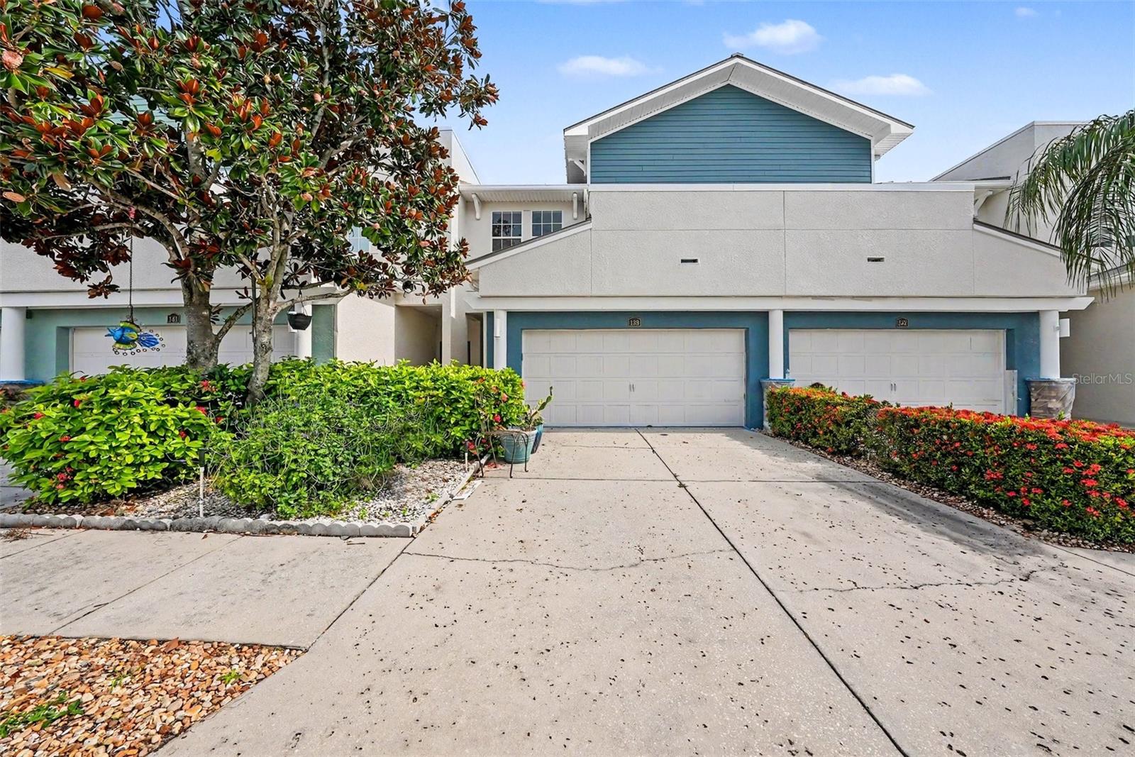 Virtually Staged. Welcome to the heart of Tarpon Springs, just steps from the legendary Sponge Docks, Pinellas Trail, and the charm of historic downtown. This beautifully designed two-story townhome offers 3 bedrooms, 2.5 baths, and a 2-car garage, blending modern comfort with timeless style. Inside, you’ll find a host of custom features, including granite countertops, rich cabinetry, a breakfast bar, a striking staircase, and elegant fixtures—all complemented by stainless steel appliances. The primary suite is a true retreat with a walk-in closet, spa-like bath featuring a garden tub and separate shower, plus a private sitting area and balcony overlooking the community pool. The open, flowing floor plan is ideal for both daily living and entertaining, while outdoor living shines with a partially screened lanai and an open sundeck offering tranquil lake and fountain views. Nestled in a vibrant yet peaceful community, this residence is perfect as a full-time home or vacation retreat—just minutes from the beach, schools, and shopping. Come experience the beauty and lifestyle of Tarpon Springs—your new home awaits.