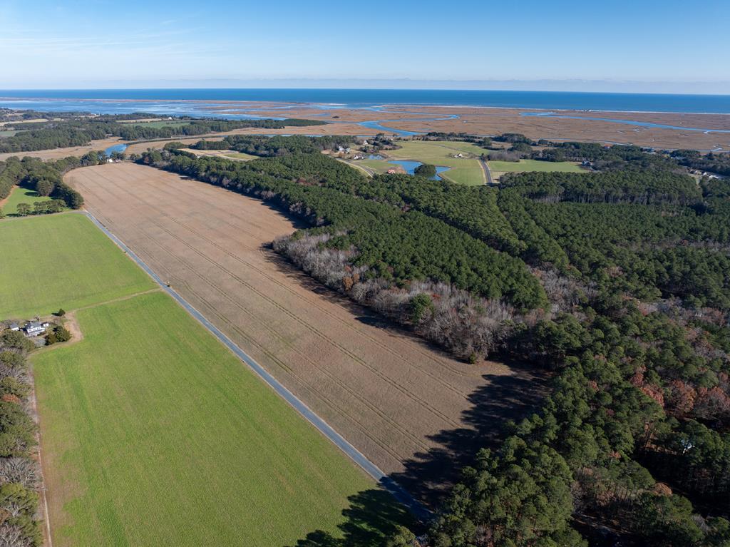 Located in the heart of Virginia's Eastern Shore, this 93 acre tract on Folly Creek Road offers a blend of productive farmland, timber value, and coastal access. Just minutes from the Folly Creek Boat Ramp, owners can enjoy paddling, fishing, and access to Metompkin and Cedar Islands. The property includes 61 tillable acres and 32 timbered acres, featuring Bojack soils known for strong drainage and crop versatility. With ample road frontage, it is well suited for farming, recreational use, or potential rural homesites. Conveniently located near Accomac, Parksley, and Onancock, this tract provides a rare opportunity to own acreage in a naturally rich and scenic area of the Eastern Shore.