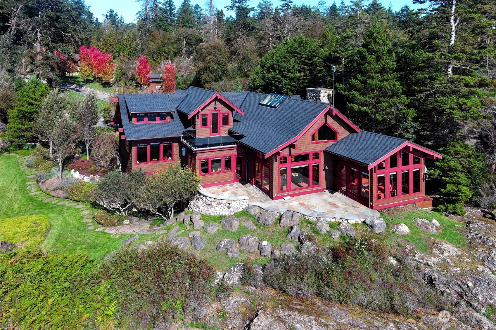 Perched at the water’s edge on the coveted southwest shores of San Juan Island. Showcasing exquisite craftsmanship throughout. The great room, with a soaring ceiling and floor to ceiling river rock fireplace, flows to a stone patio overlooking Haro Strait and the Olympic Mountains. The main floor primary suite affords spectacular water and mountain views. The lower level features a home theater, water view guest suite, workshop with stainless steel countertops, and a large laundry room with a dog wash station. 1165 sf guest cottage, two 3-car garages, a 4-bay service garage, and landscaping serviced with a smart water system. State-of-the-art D-Salinization water system. 3.2 acres and 368 ft of shoreline. Being sold Turn-key!