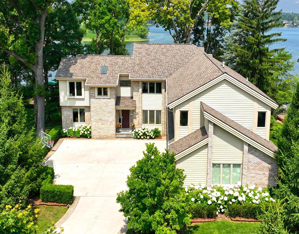 Welcome to your dream home on private, all-sports Voorheis Lake in Lake Orion. This magnificent lakefront retreat offers 96ft of pristine shoreline & over 5,000sf of beautifully finished living space. With 5 bedrooms and 4.5 baths, there's room for everyone to relax and enjoy. Take in breathtaking lake views and unforgettable sunsets from the custom kitchen and rear deck, both designed for function & perfect for entertaining. Walkout lower level is a true entertainer's paradise, featuring a wet bar, full bath, and direct access to the patio and the meticulously landscaped yard. Additional highlights include a 3-car garage, serene setting on a quiet dead-end street, and luxurious finishes throughout. Don't miss this rare opportunity to own a slice of waterfront paradise!Welcome to your dream home on private, all-sports Voorhies Lake in Lake Orion. This magnificent lakefront retreat offers 96ft of pristine shoreline & over 5,000sf of beautifully finished living space. With 5 bedrooms and 4.5 baths, there's room for everyone to relax and enjoy. Take in breathtaking lake views and unforgettable sunsets from the custom kitchen and rear deck, both designed for function & perfect for entertaining. Walkout lower level is a true entertainer's paradise, featuring a wet bar, full bath, and direct access to the patio and the meticulously landscaped yard. Additional highlights include a 3-car garage, serene setting on a quiet dead-end street, and luxurious finishes throughout. Whether you're boating, entertaining, or simply soaking in the view, this home offers the best of lakefront living just minutes from everything. Don't miss this rare opportunity to own a slice of waterfront paradise!