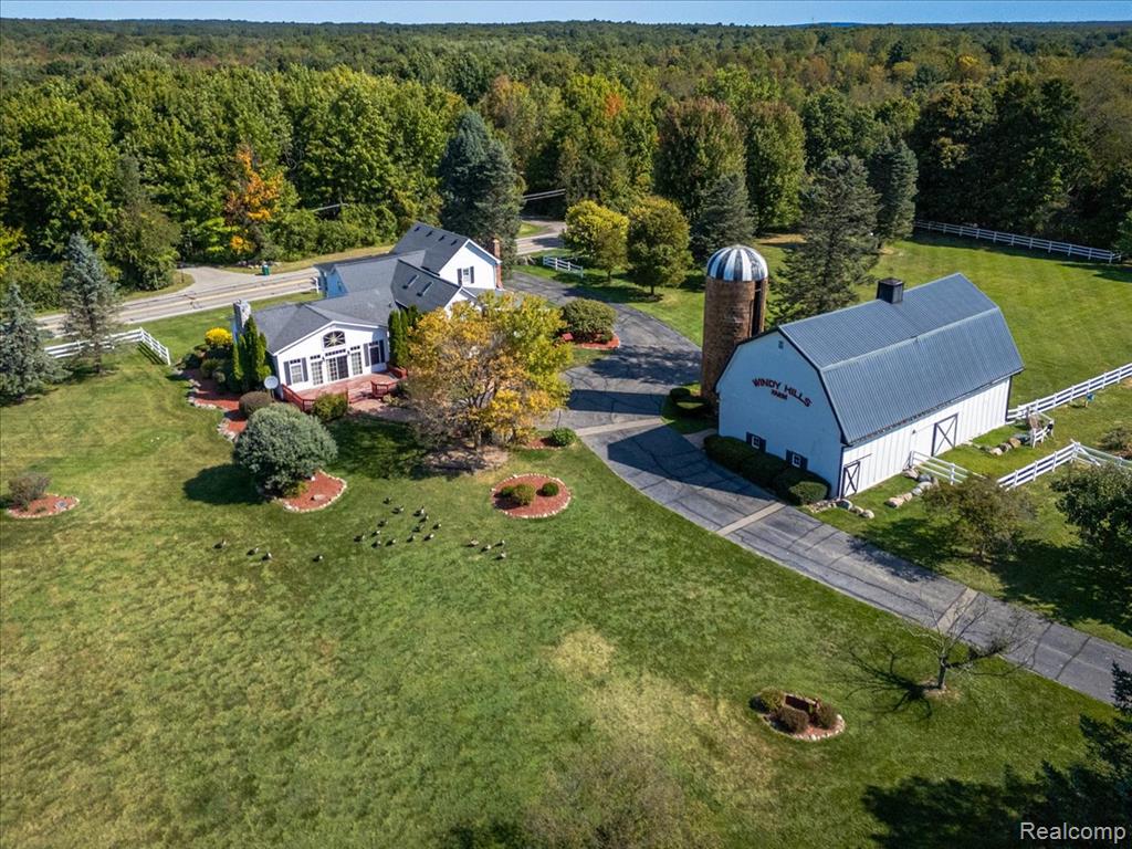 Welcome to a place where history, family, and wide-open spaces come together. Tucked away on nearly 40 acres of beautifully cared-for land, this property offers all the charm of country living—while still being set on a paved road for everyday convenience.
The land is mostly fenced and ready for animals, with four barns that each carry their own purpose. One barn includes three horse stalls, another is heated for year-round projects or livestock care, and together they create endless possibilities for farming, animals, or storage. Once home to both cows and horses, the property is perfectly suited for anyone who dreams of homesteading or living off the land. Adding to the natural beauty are three spring-fed ponds, peaceful and full of life.
At the heart of it all is a home with true character, originally built in 1901. Its walls hold more than a century of stories, and the current owners purchased it with their own dream in mind: a place where their family could grow, work, and create lasting memories. Now, they’re passing that dream along—for a new family to write their own chapter here.
Whether you imagine horses grazing in the fields, gardens that stretch across the property, or simply the peace of country sunsets on your porch, this estate is ready to welcome you home.