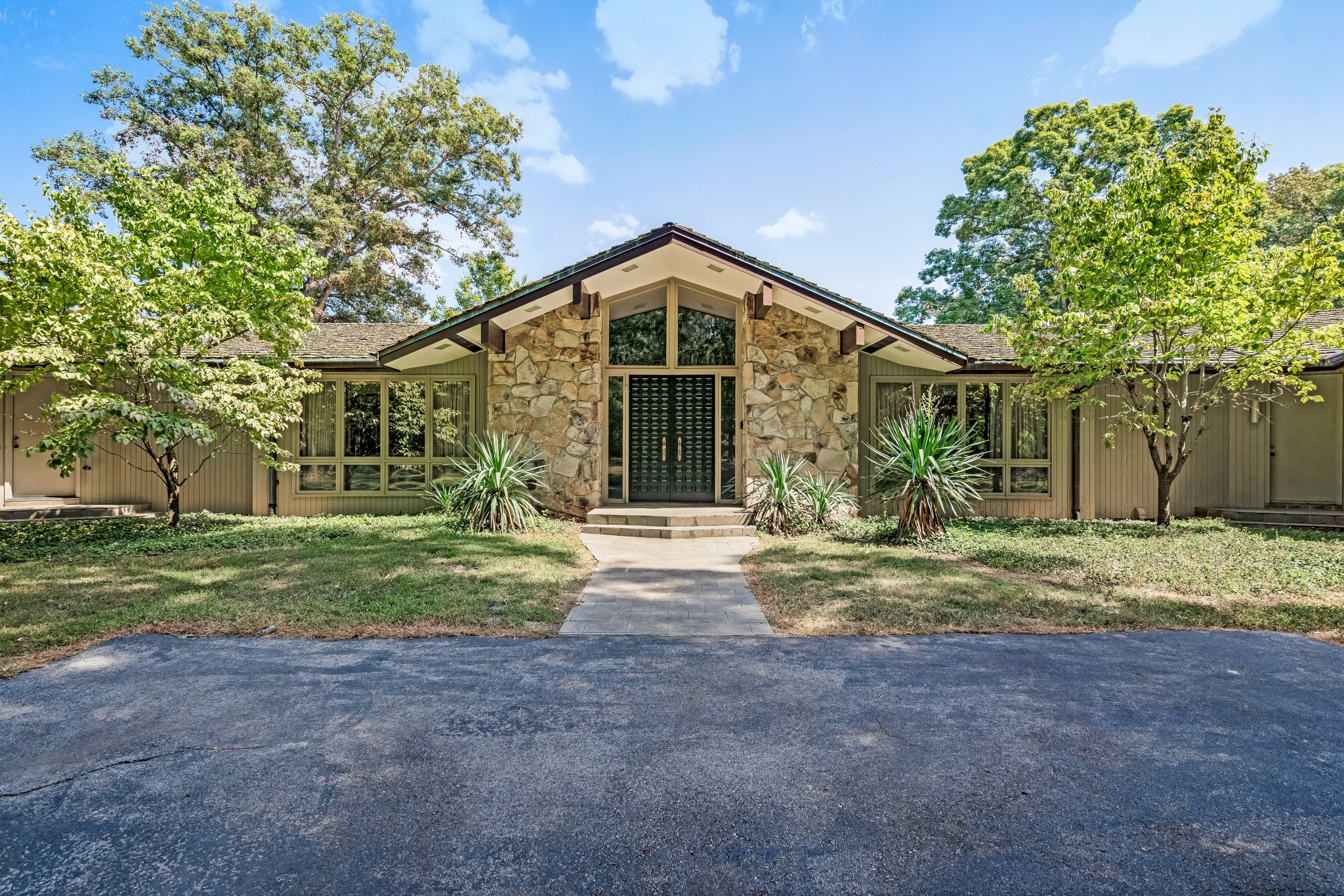 Exquisite Mid-Century Modern Estate | 215 Hickory Lane, Smithville, TN.  This custom-designed Mid-Century Modern home offers luxurious living just minutes from Center Hill Lake, the Smithville Municipal Golf Course, and an hour from Nashville International Airport.  Spanning 9,598 sq. ft., this 8-bed, 7-bath estate sits on 8.83 acres (with an option to expand to 18.24 acres). The open-concept design features Pella windows, stone, wood, and glass for a warm, light-filled ambiance.
Amenities include:
• Lagoon-style pool with cabana (640 sq. ft., includes bath/shower & half bath)
• Tennis court & expansive yards for recreation
• Two primary suites with jetted tubs; one with a screened-in patio
• Updated kitchen blending modern function with Mid-Century charm
• Whole-home generator for peace of mind
A rare opportunity to own a tranquil yet accessible masterpiece. Schedule your private tour today!
See full description attached below.