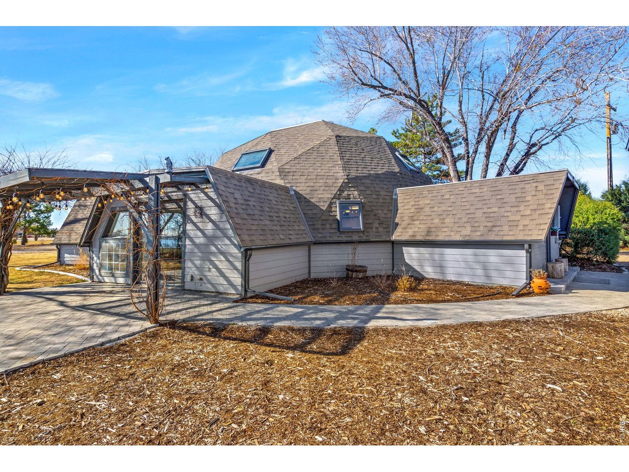 Set on 2.2 scenic acres in south Fort Collins, this one-of-a-kind property offers breathtaking views of Donath Lake and the surrounding mountains-without the constraints of an HOA. Zoned FA1, it provides exceptional versatility, accommodating everything from home-based businesses to horses, RV parking, and additional structures, making it an ideal fit for a variety of lifestyles. The inviting home includes 3 generously sized bedrooms and 2 thoughtfully updated bathrooms, blending comfort with modern style, plus newly refreshed interior drywall and paint. A light-filled sunroom creates the perfect spot to enjoy Colorado's sunshine in every season, while the wet bar enhances the home's entertaining appeal-all framed by stunning lake views. The outdoor space is equally impressive, featuring a detached garage/shop, chicken coop, and expansive grounds ready for gardening, animals, or future projects. Ditch water rights are also available for purchase, adding valuable potential for those looking to cultivate or expand. Offering a rare combination of space, flexibility, and proximity to Fort Collins amenities, this property delivers the freedom to create the lifestyle you've been looking for.
