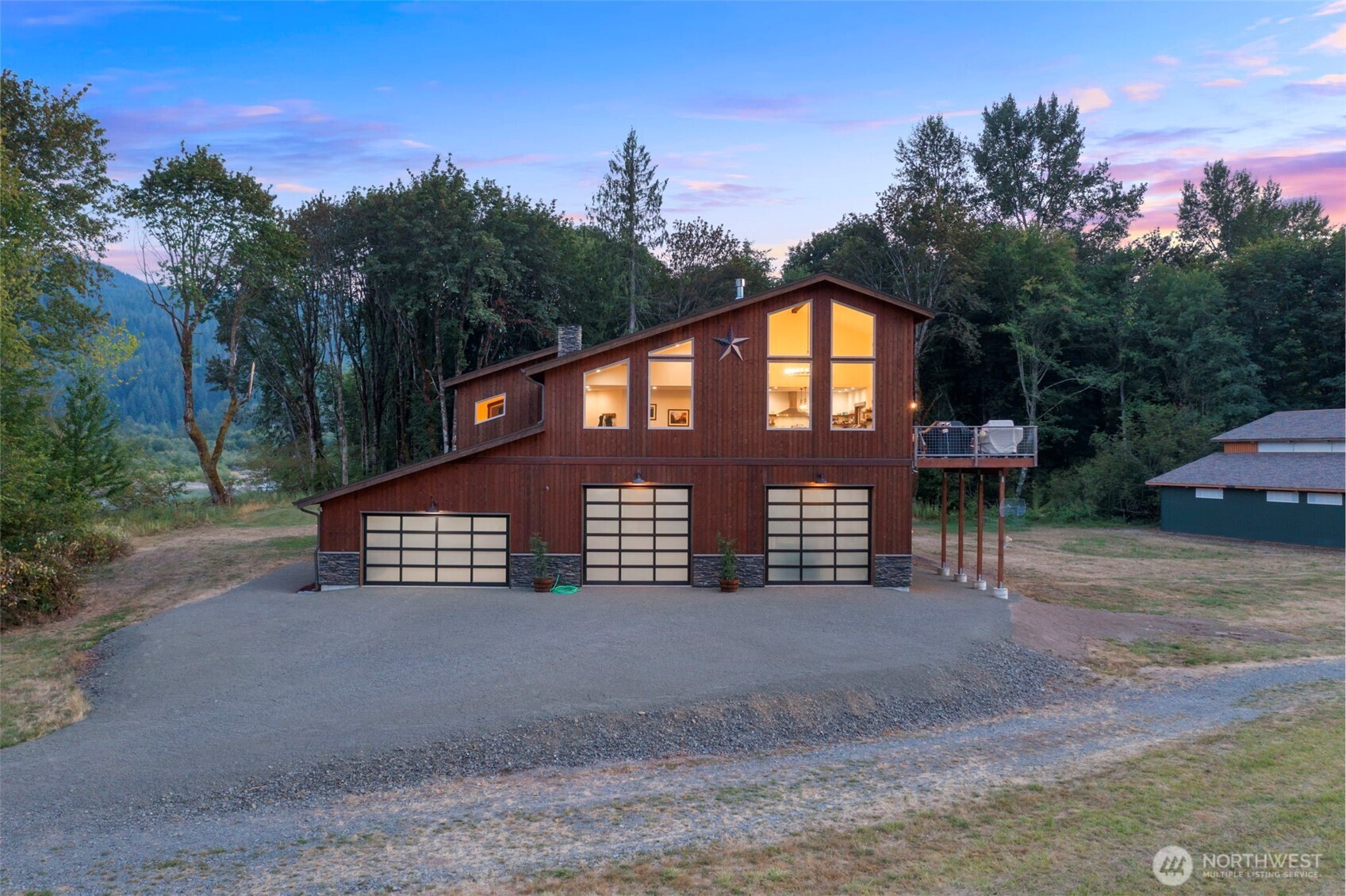 Where luxury meets the outdoor! Views! Welcome to the L2 Estate, a 5 Star, rare 78-acre paradise near Mt. Rainier on the Cowlitz River. This 3732SF custom-built masterpiece delivers stunning river and mountain views from every angle, wrapped in exquisite craftsmanship and surrounded by nature! Inside, soaring ceilings and floor-to-ceiling windows flood the open-concept living space with lots of light. The gourmet Chef's kitchen stuns with Café appliances, dual ranges, a grand island ~ perfect for entertaining and gathering, huge walk-in pantry and every cooking essential imaginable.  Unwind by the fireplace in the expansive living room, dine with a view, then step onto the large deck w/ hot tub — as elk roam the property below. The master suite is a true retreat: spa-like soaking tub, sectional lounge, and walk-in closet. Two generous bedrooms with large windows & closets, tall ceilings, plus a den-study, and large laundry room with extras ~round out the living quarters perfectly! 4784SF Attached garage with workshop and half bath. Outside, the possibilities are limitless! Massive 80x80 barn, RV hookups, firepits, private hunting grounds, direct river access, and room for a private airstrip. The estate's proven revenue potential shines as an established STR, 5 Star Airbnb and private venue destination, making this as smart an investment as it is a dream home. Located near Packwood, White Pass Skiing, endless recreation. Timber and Ag land designations. Own the extraordinary!