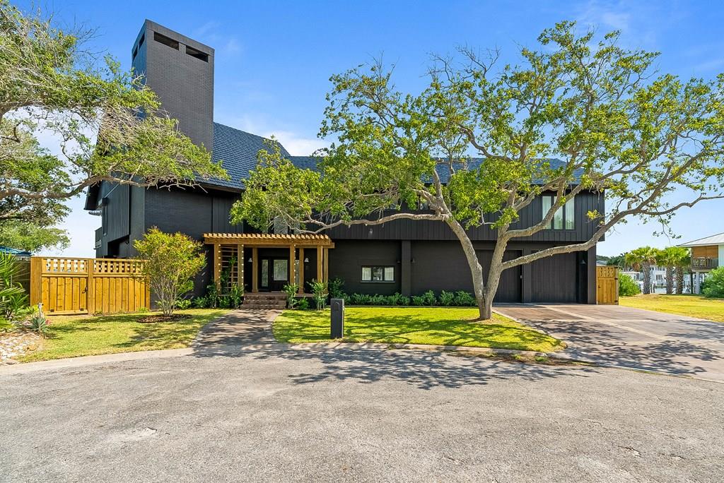 A rare point-lot estate on Key Allegro, blending resort-caliber living with everyday comfort. Designed for effortless entertaining and quiet coastal retreats, 25 Bimini spans nearly 7,000 sqft under roof (~5,700 living) with expansive terraces overlooking Little Bay. Built to withstand the coast, the home features cinder block + steel construction, aluminum roof, generator, and a rare cut-in covered boat slip. Inside: 4 bedrooms / 4 baths, a soaring 20' great room with 12' bifold doors, and a 4-car garage offering room for vehicles and watercraft. An elevator connects all levels, while a commercial gym and secure vault add rare amenities. The kitchen is equipped for both large gatherings and formal entertaining with La Cornue ranges, Sub-Zero Pro 48, and a Belgian bluestone island. The primary suite offers a spa-like escape with an imported Italian marble tub. Upstairs, almost 3,500 sqft of red oak flooring, two fireplaces, a custom library/guest suite, and a 100' pergola extend the living experience. A pre-designed pool/outdoor living package with renderings is available, offering a turnkey option to enhance the estate. 25 Bimini offers exclusivity, scale, and design unmatched on the island — equally suited for a primary residence or a luxurious second home.