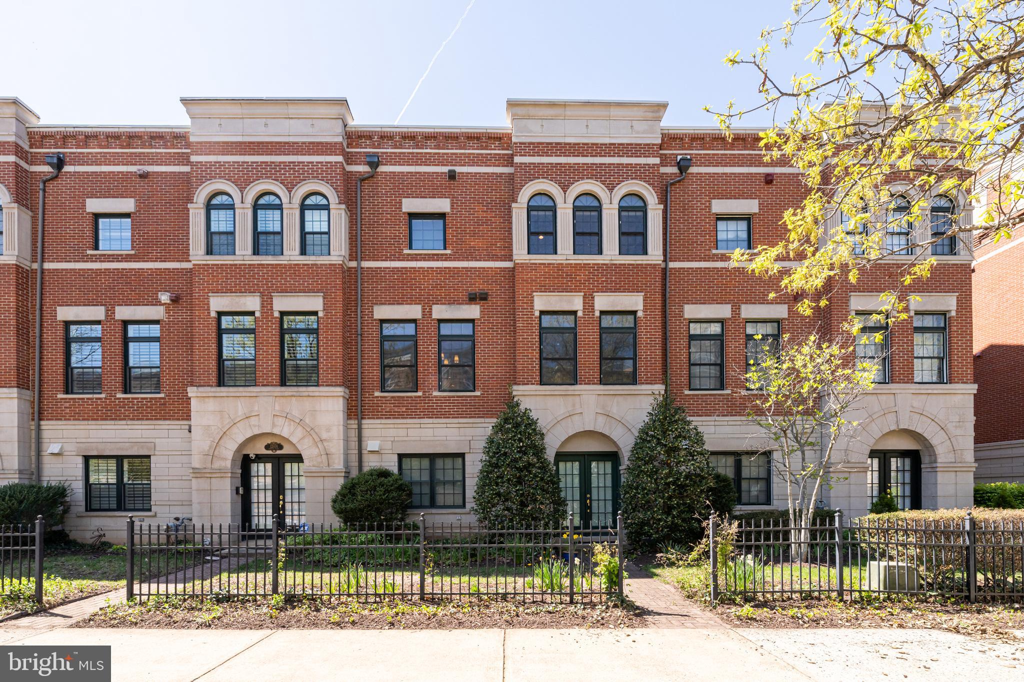 Welcome to 12076 Kinsley Place - a rare offering that blends the vibrant convenience of city living with the tranquility of a private, tree-lined community. This stately, four-level, all-brick townhouse is located in the highly sought-after West Market community, directly across from Reston Town Center. The home is bathed in natural light, highlighting architectural details like built-ins, crown molding, and wainscoting. Warm, cohesive paint colors perfectly complement the hardwood flooring throughout. The entry level features a welcoming foyer, a versatile guest room or office, a half-bath, and a two-car garage. The main level serves as the heart of the home, featuring a gourmet kitchen with Viking and Miele appliances, a breakfast nook overlooking lush greenery, and a cozy seating area with a stone-surround gas fireplace. This level is rounded out by spacious formal living and dining rooms. Upstairs, the primary suite offers a stunningly renovated ensuite bath, walk-in closets, and oversized windows overlooking protected green space. A second bedroom with its own ensuite and a dedicated laundry closet complete this floor. The top-level loft features a second gas fireplace and a private terrace—ideal for entertaining or unwinding. West Market residents enjoy a private clubhouse, fitness center, pool, and direct access to the W&OD Trail. You are steps from Reston Town Center’s premier dining, retail, and cinema, and just a half-mile from the Metro. With Reston Hospital and favorites like Wegmans, Whole Foods, Target and Trader Joe’s minutes away, this is one of the area’s premier places to live! Come see for yourself all this home and neighborhood have to offer!